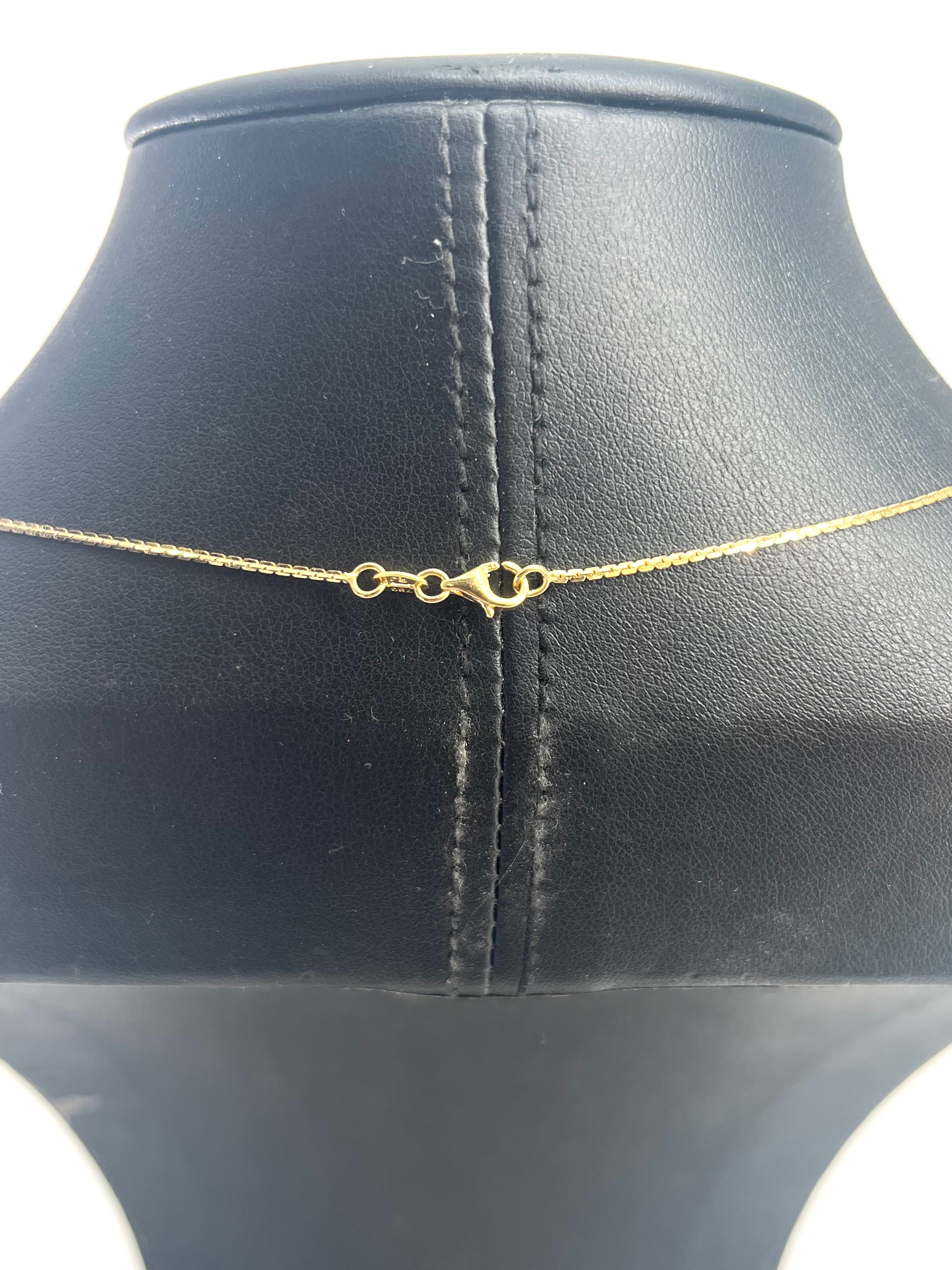 CB STORES gold box chain necklace displayed on a black stand, showing the fine links and a lobster clasp fastening.