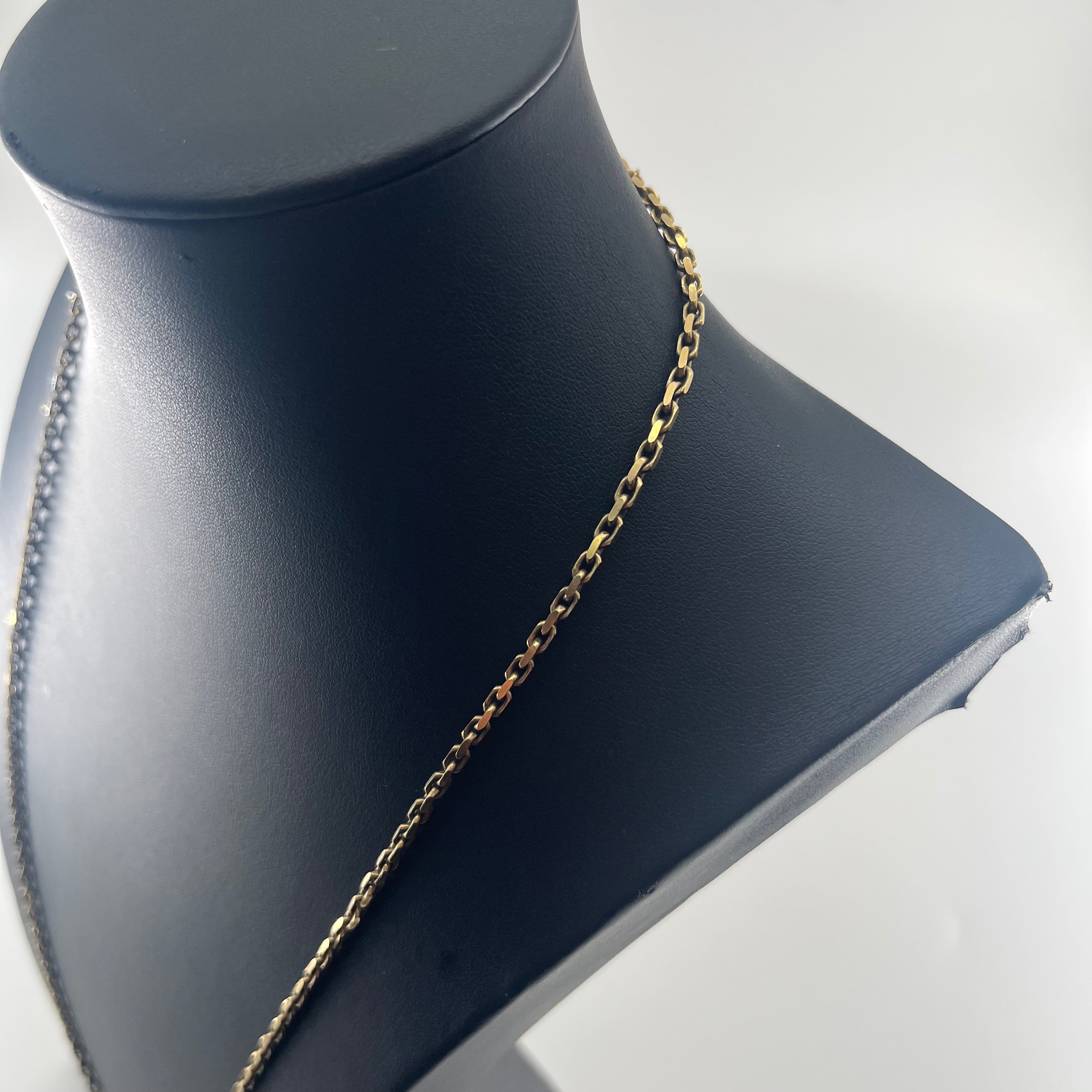 CB STORES 9ct gold anchor chain necklace displayed on a black jewellery bust against a white background.