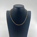 CB Stores yellow gold chain necklace with small round links, displayed on a black bust against a white background.