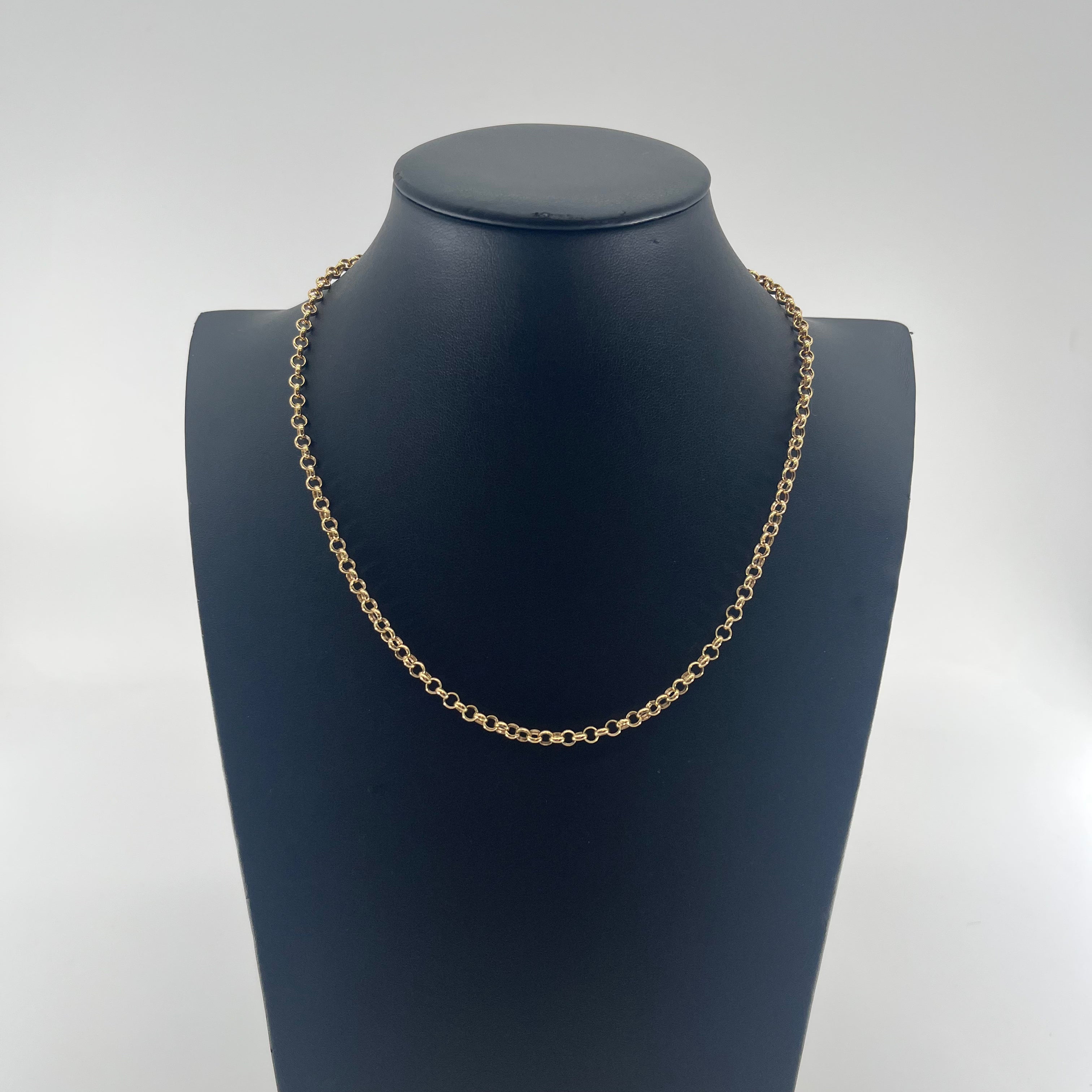 CB Stores yellow gold chain necklace with small round links, displayed on a black bust against a white background.