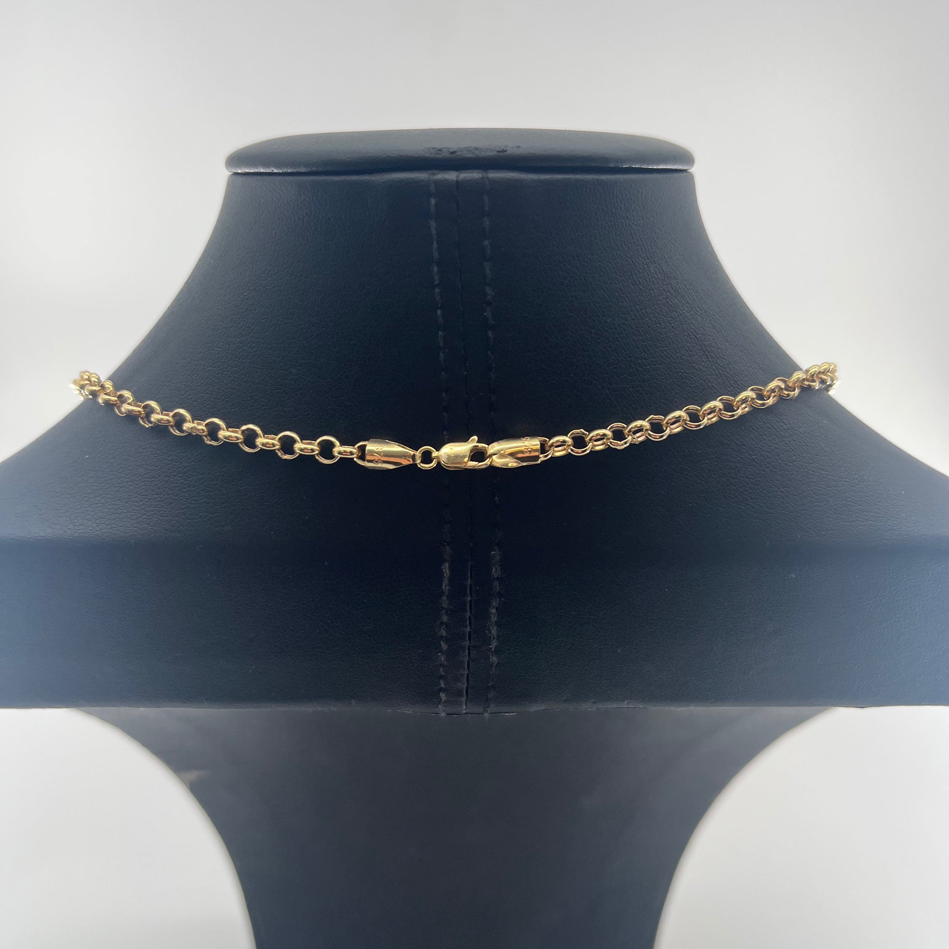 CB STORES yellow gold chain necklace shown on a black curved jewellery stand set against a plain white background.