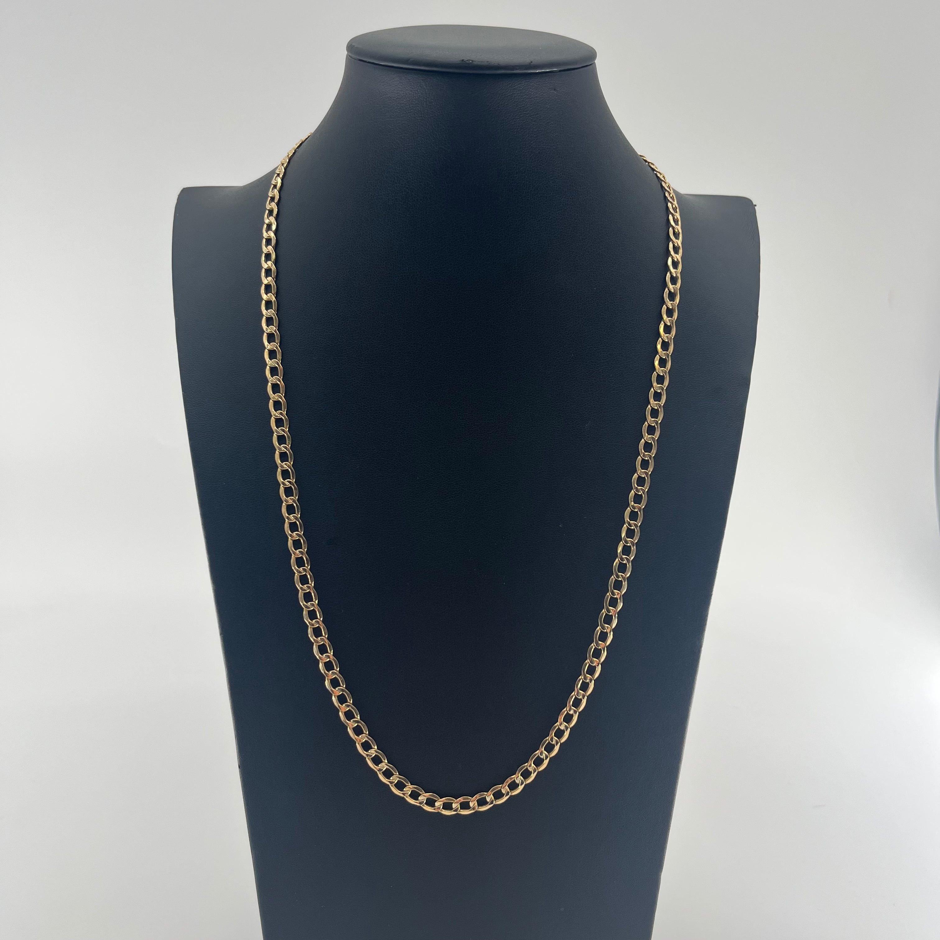 CB Stores 9ct flat curb chain displayed on a black bust stand, set against a plain white background.