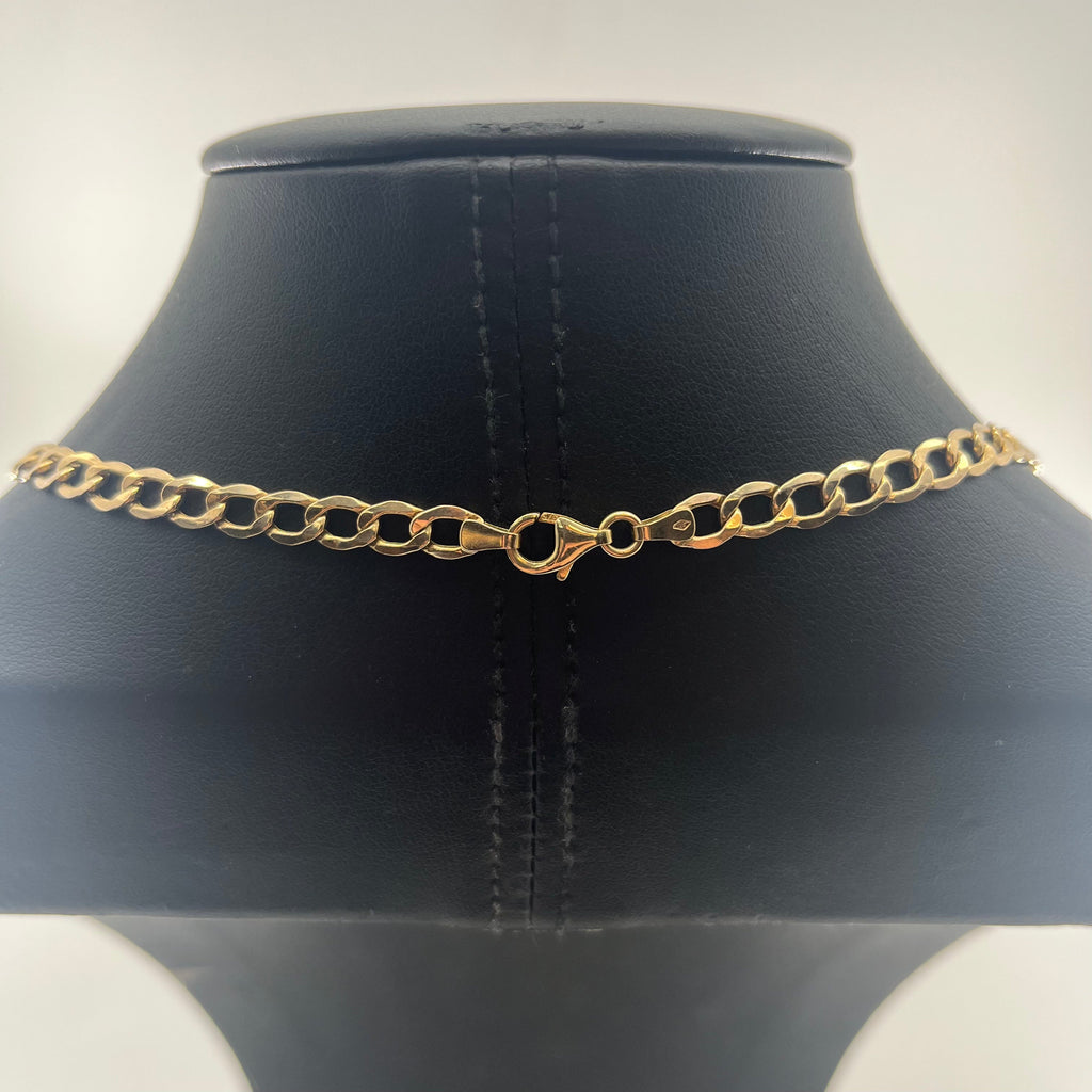 CB STORES 9ct yellow gold curb chain necklace shown from the back on a black leather stand, displaying the lobster clasp.