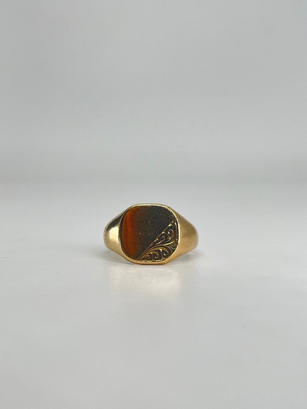 CB STORES 9ct gold square signet ring with a smooth face and engraved swirl detail on one side, displayed on a white background.