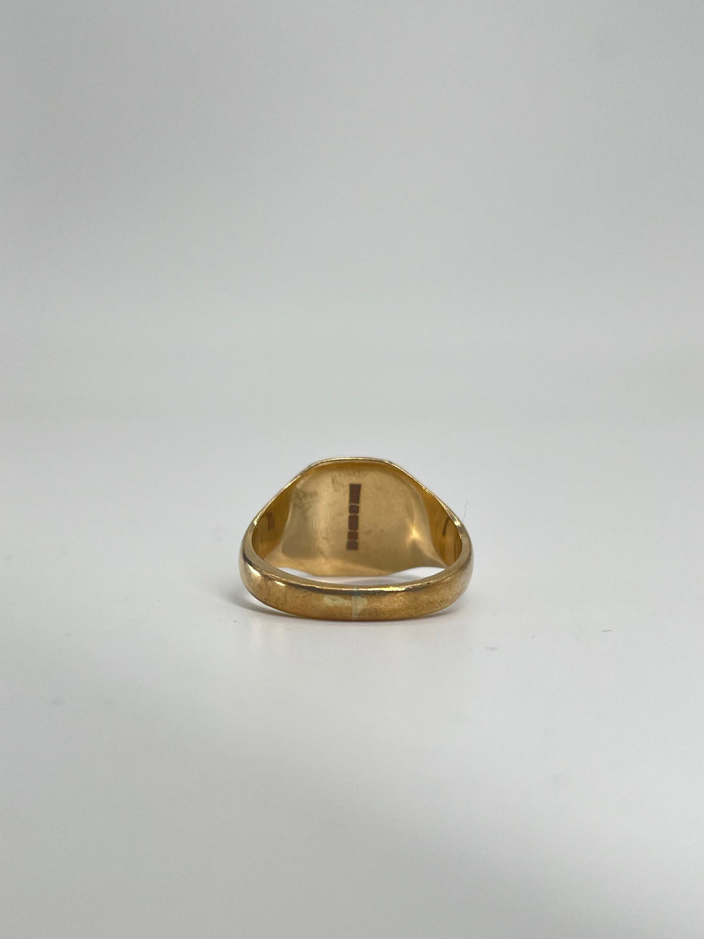 CB STORES 9ct gold square signet ring shown from a low angle on a white background, highlighting the polished inner band.