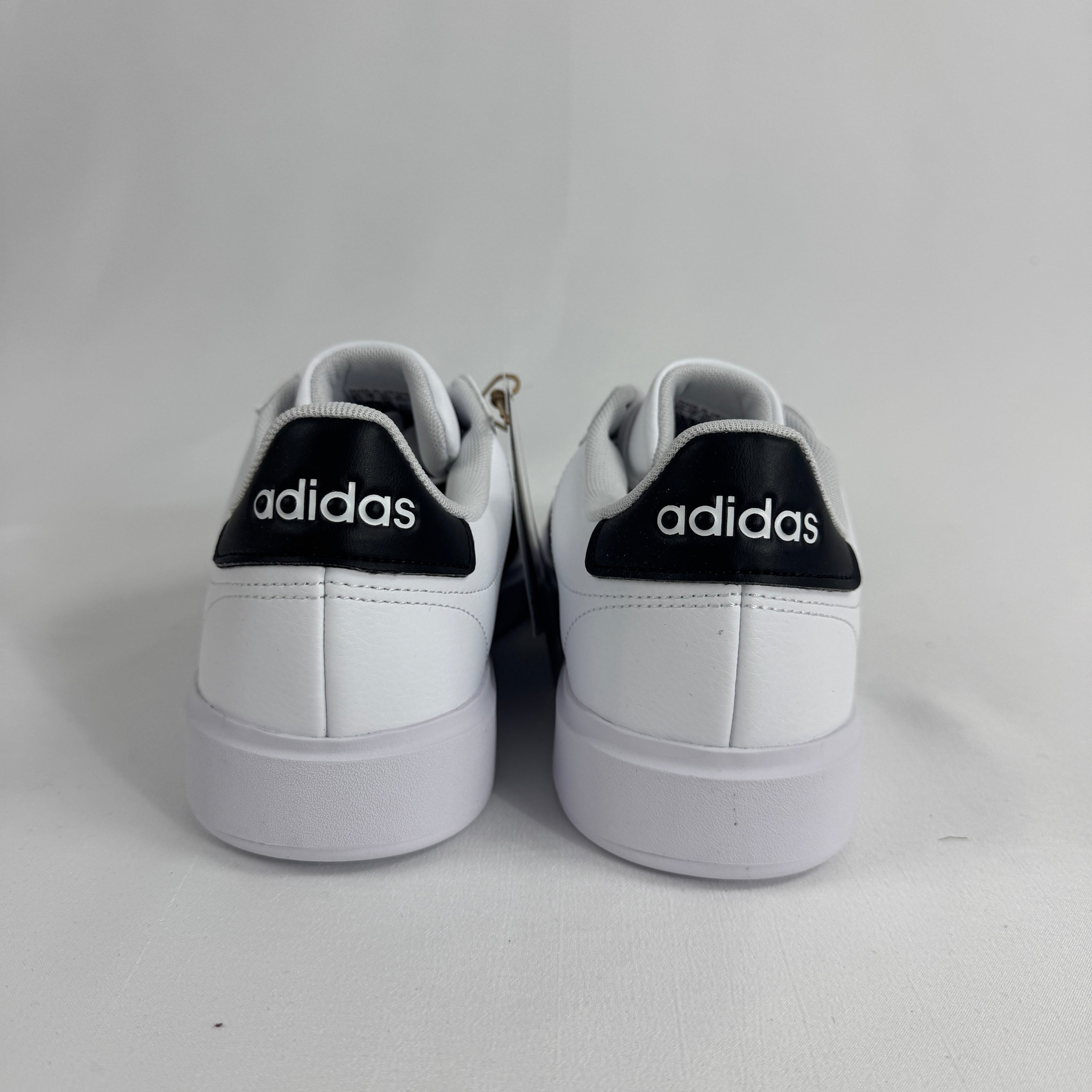 The Adidas Grand Court 2.0 is a casual court-inspired sneaker with a smooth synthetic or leather-like upper, soft