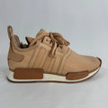 The Adidas x Hender Scheme NMD R1 is a premium collaboration that reimagines the iconic NMD with handcrafted natural leather