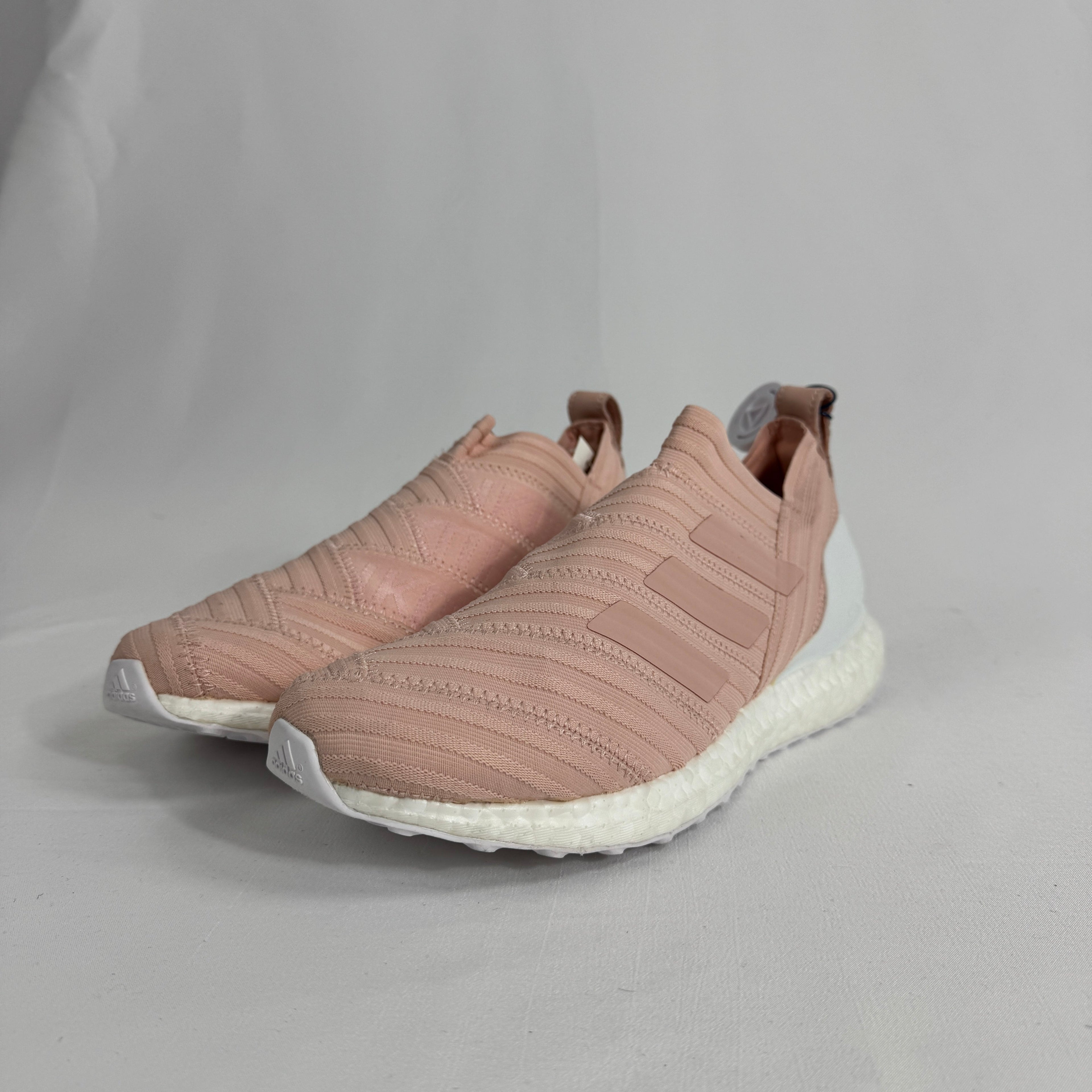 The Adidas Nemeziz Tango 17 Ultra Boost Kith Flamingo is a limited-edition sneaker that blends football-inspired design with