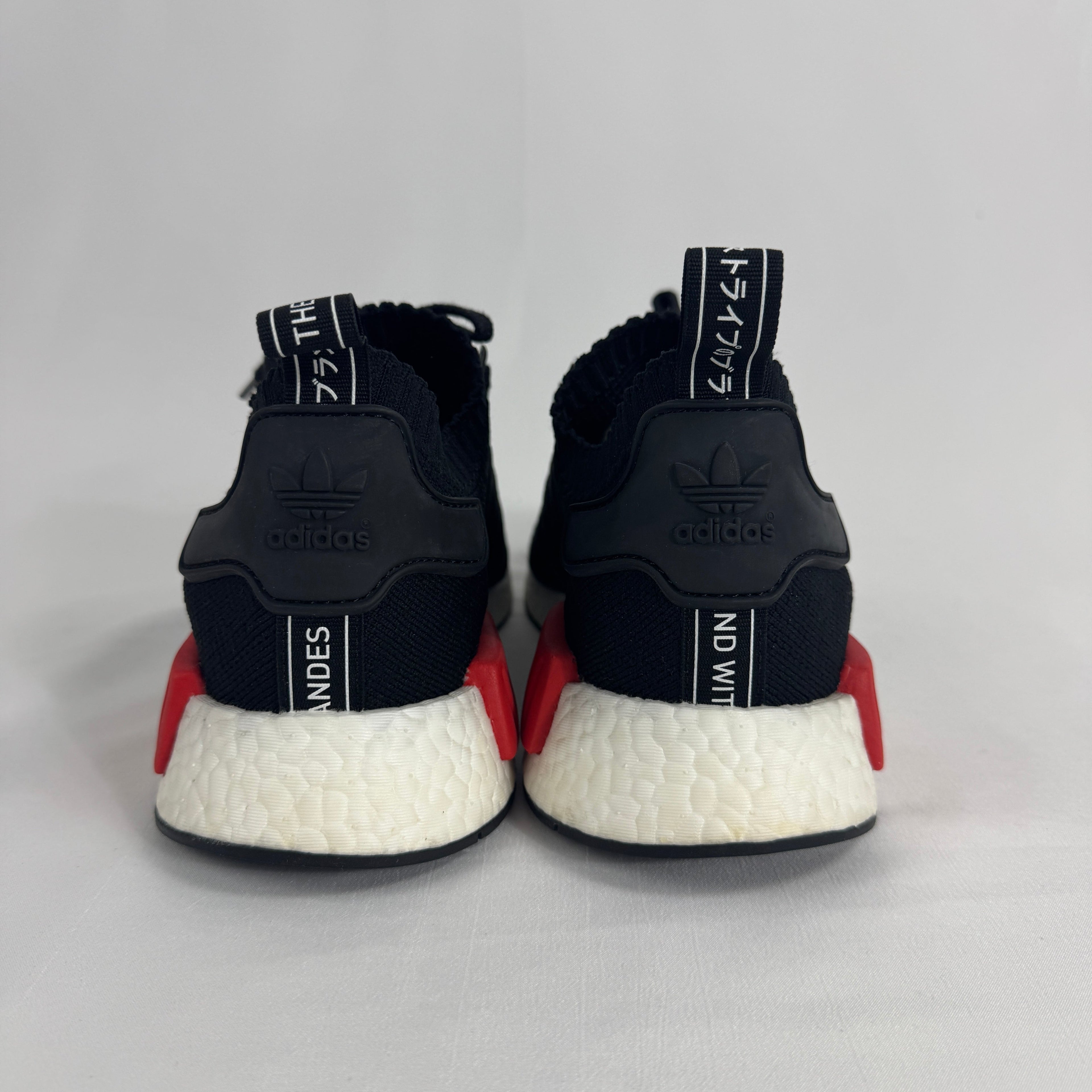 The Adidas NMD R1 Core Black is a lifestyle sneaker that combines a breathable knit upper with responsive Boost cushioning