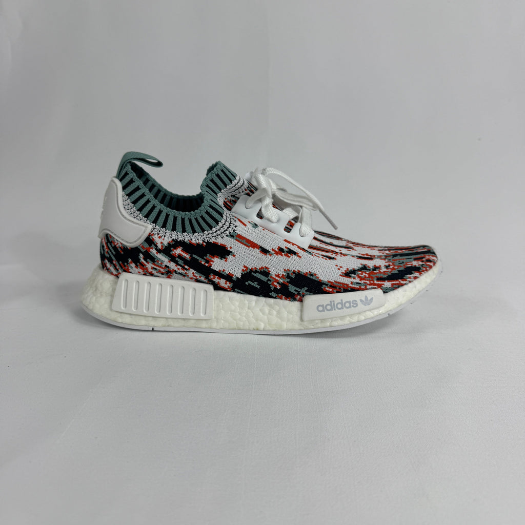 The Adidas NMD R1 Datamosh Collegiate is a lifestyle sneaker featuring a breathable knit upper with digitally inspired