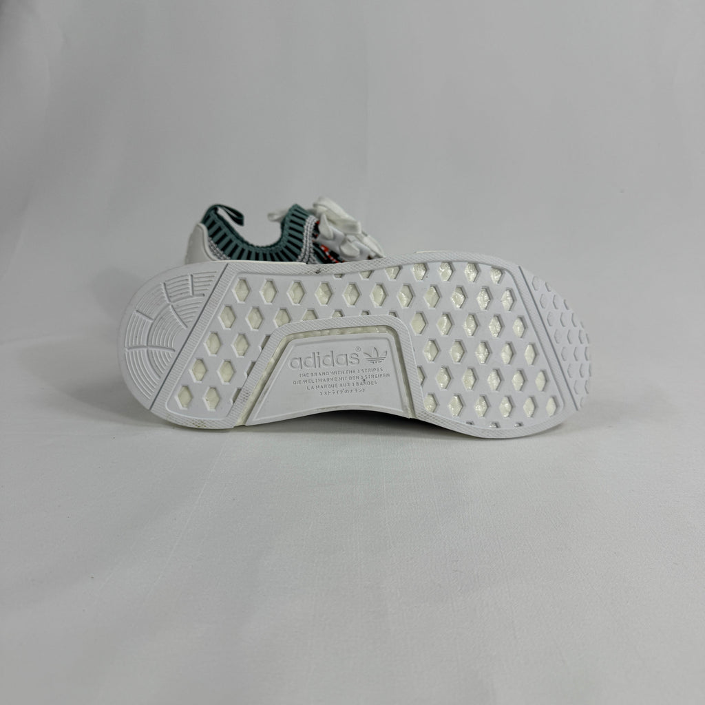 The Adidas NMD R1 Datamosh Collegiate is a lifestyle sneaker featuring a breathable knit upper with digitally inspired