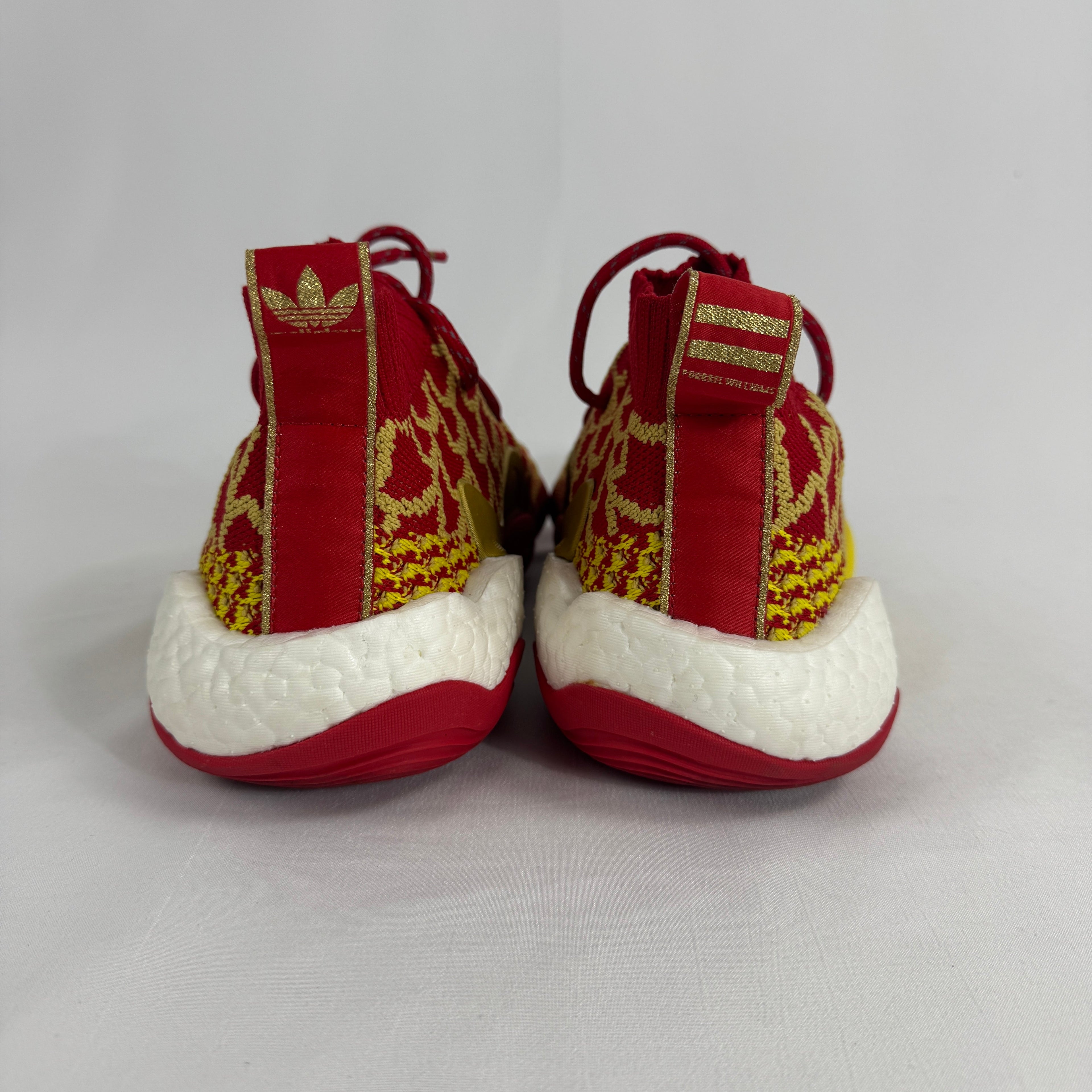 The Adidas PW x BYW CNY is a special edition sneaker designed by Pharrell Williams to celebrate the Chinese New Year. It