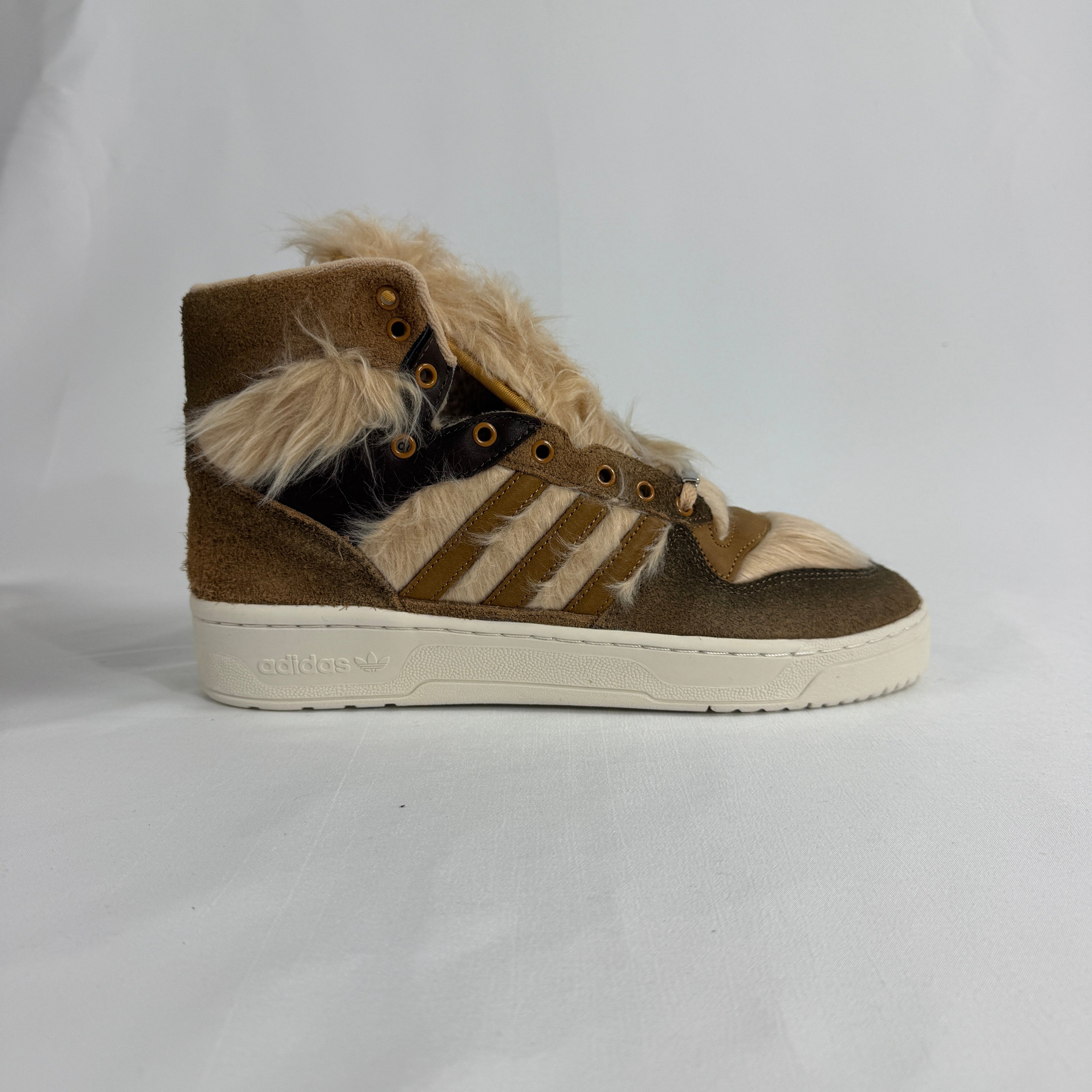 The Adidas Rivalry Hi Star Wars Chewbacca is a high-top sneaker inspired by the iconic Star Wars character, featuring
