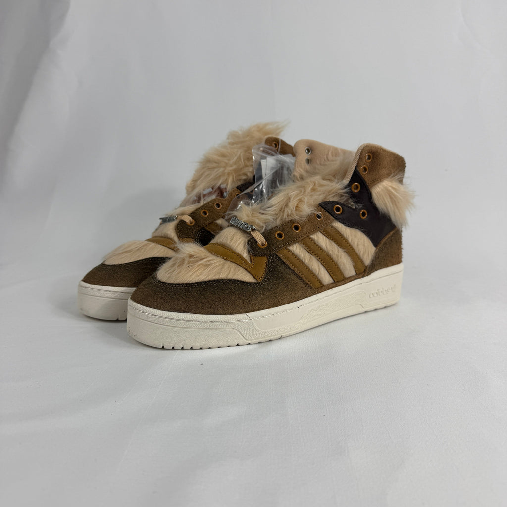 The Adidas Rivalry Hi Star Wars Chewbacca is a high-top sneaker inspired by the iconic Star Wars character, featuring
