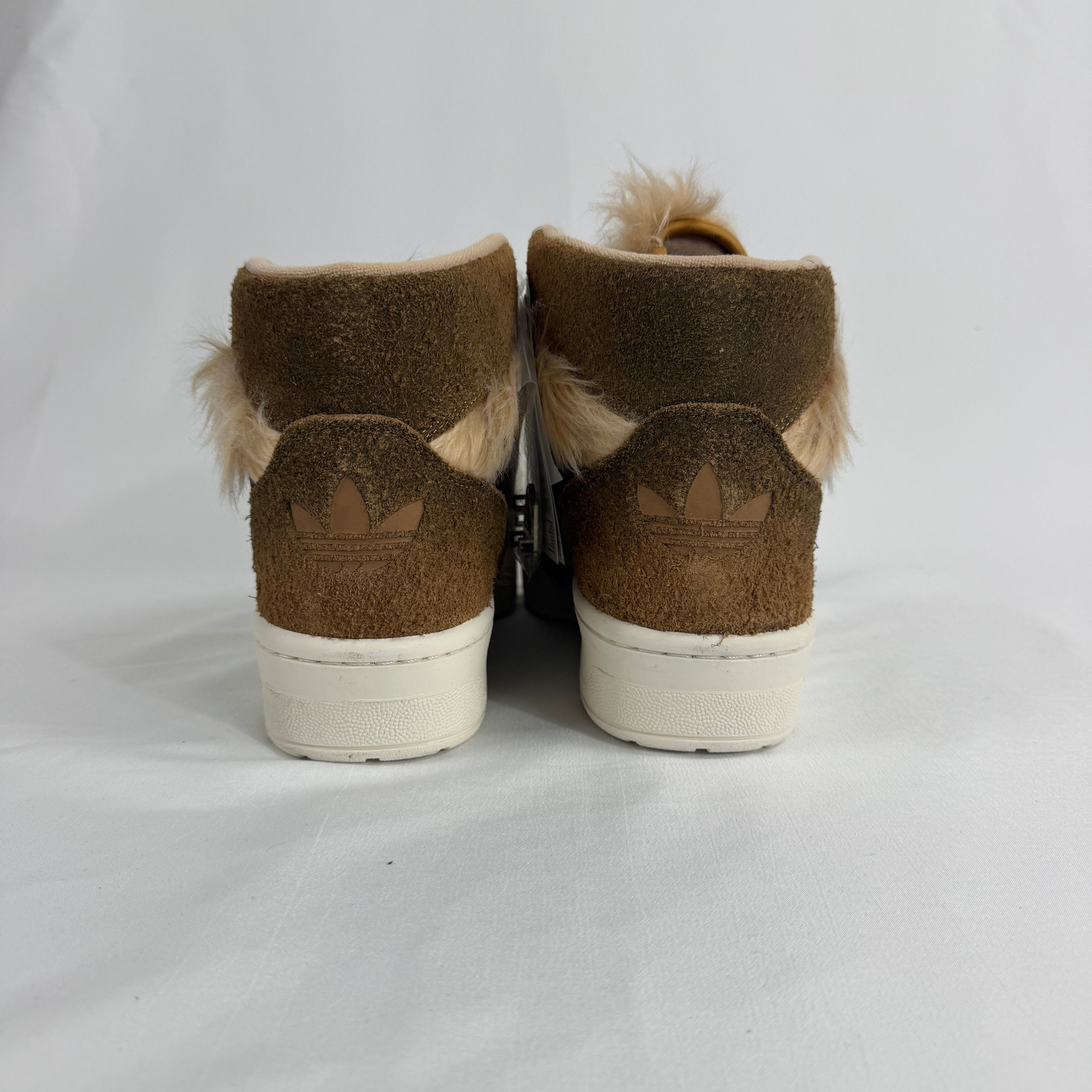 The Adidas Rivalry Hi Star Wars Chewbacca is a high-top sneaker inspired by the iconic Star Wars character, featuring