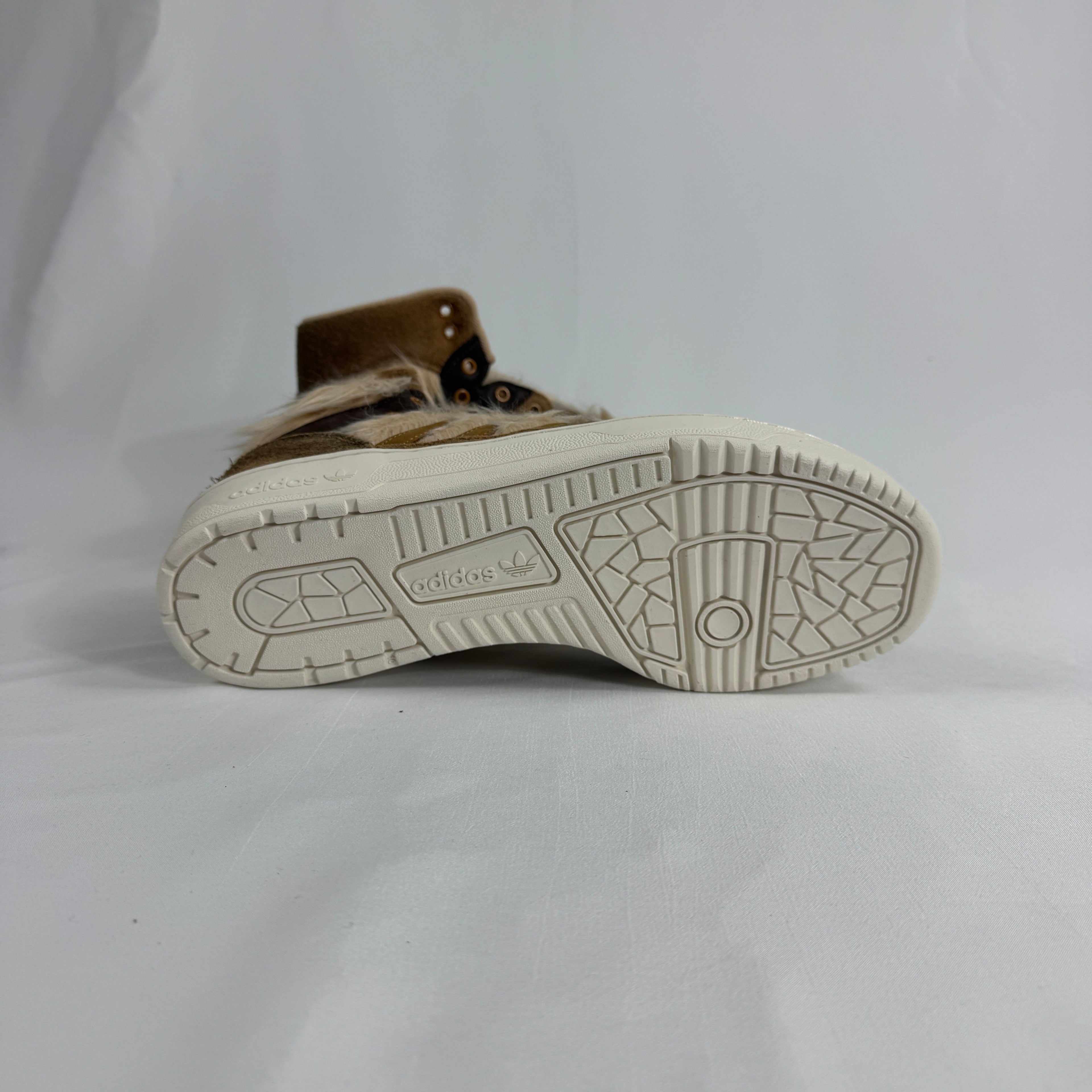 The Adidas Rivalry Hi Star Wars Chewbacca is a high-top sneaker inspired by the iconic Star Wars character, featuring