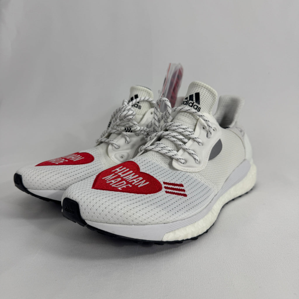 The Adidas Solar Hu Human Made is a collaborative sneaker that combines Pharrell Williams' Solar Hu silhouette with Human