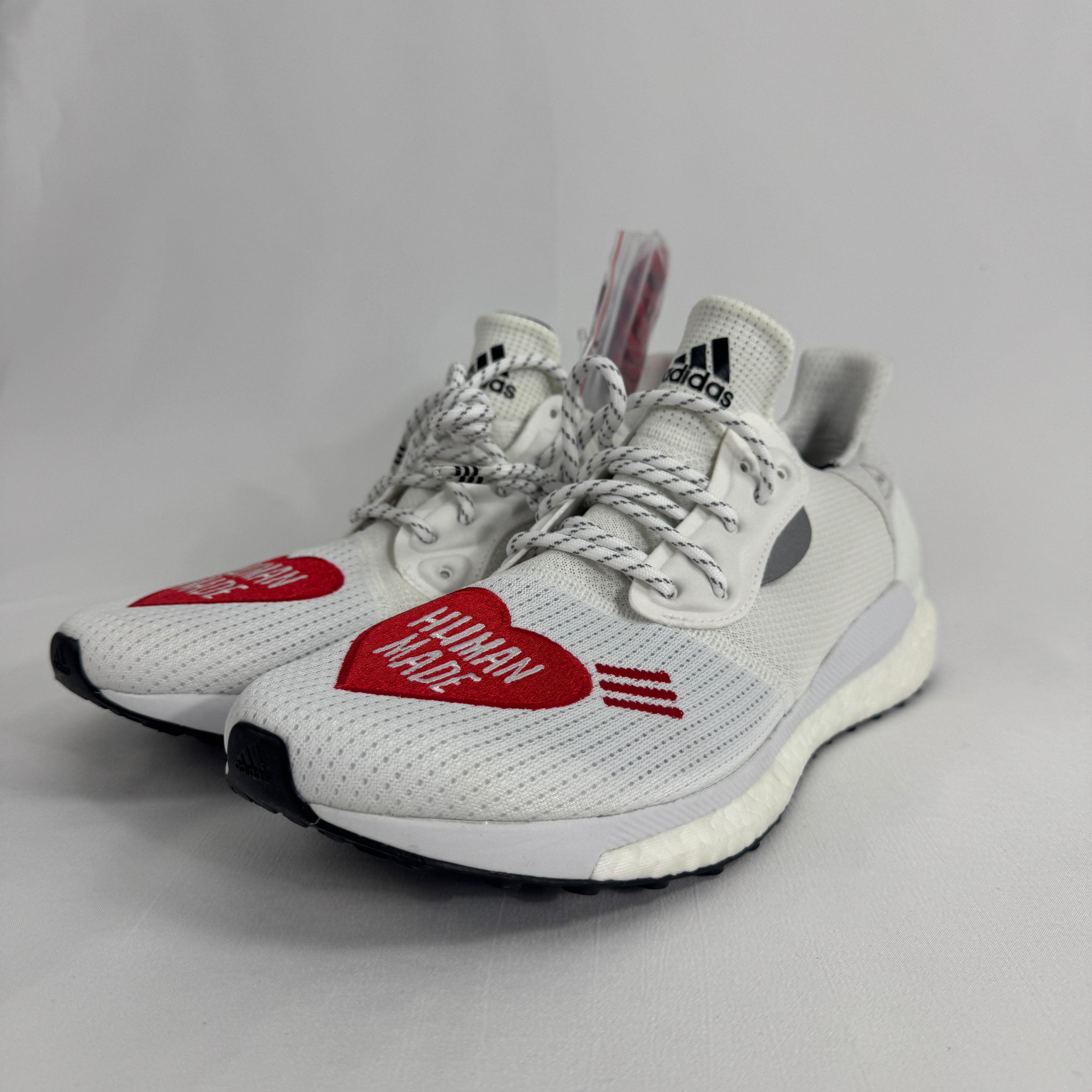 The Adidas Solar Hu Human Made is a collaborative sneaker that combines Pharrell Williams' Solar Hu silhouette with Human