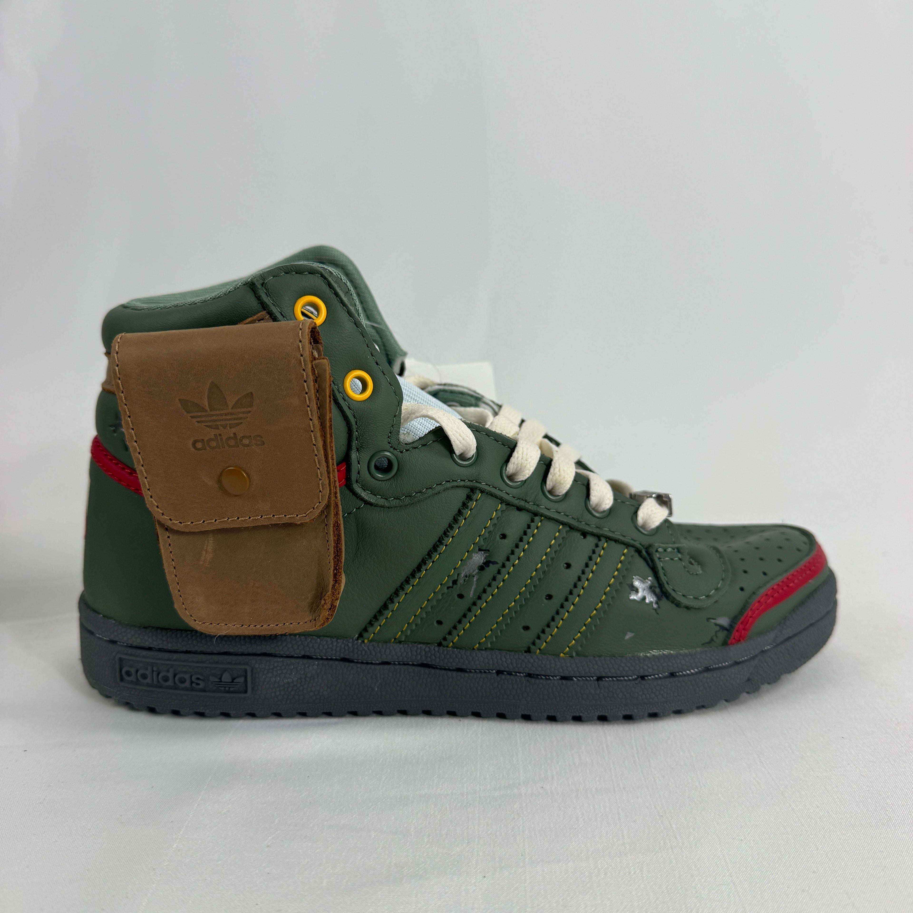 The Adidas Top Ten Hi Star Wars Boba Fett is a high-top basketball-inspired sneaker themed around the Star Wars bounty