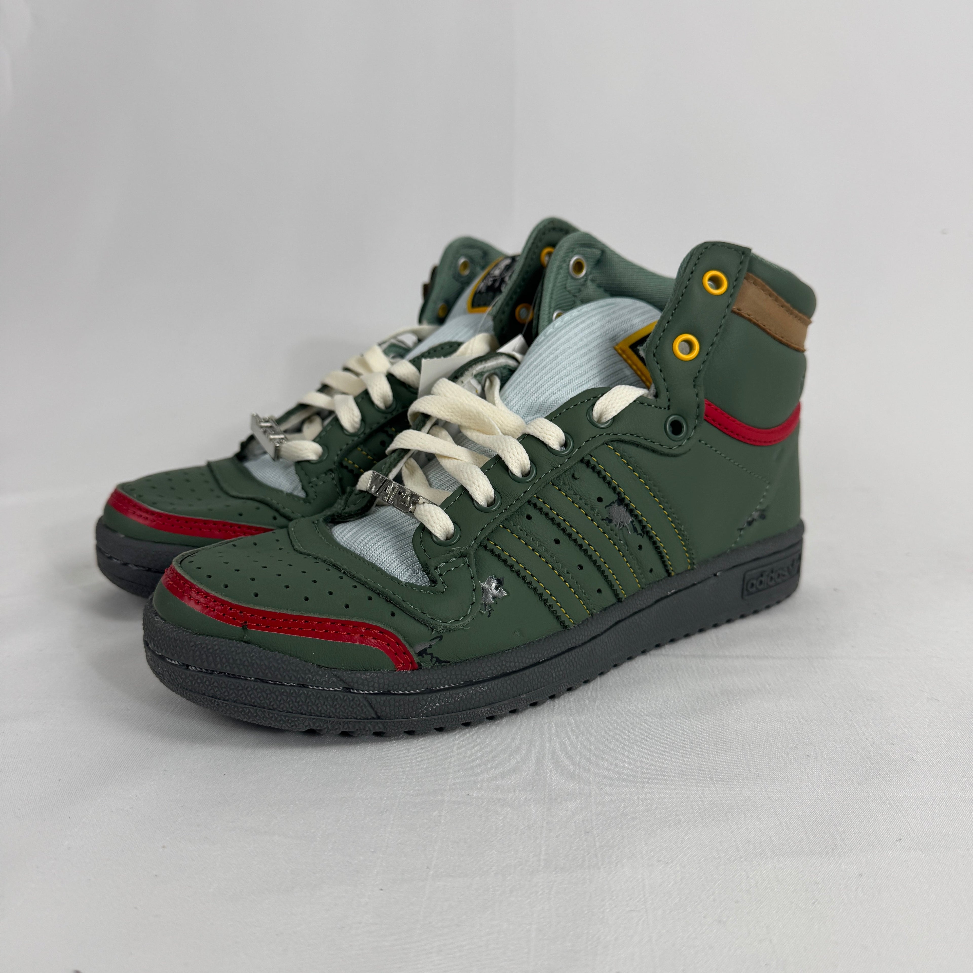 The Adidas Top Ten Hi Star Wars Boba Fett is a high-top basketball-inspired sneaker themed around the Star Wars bounty