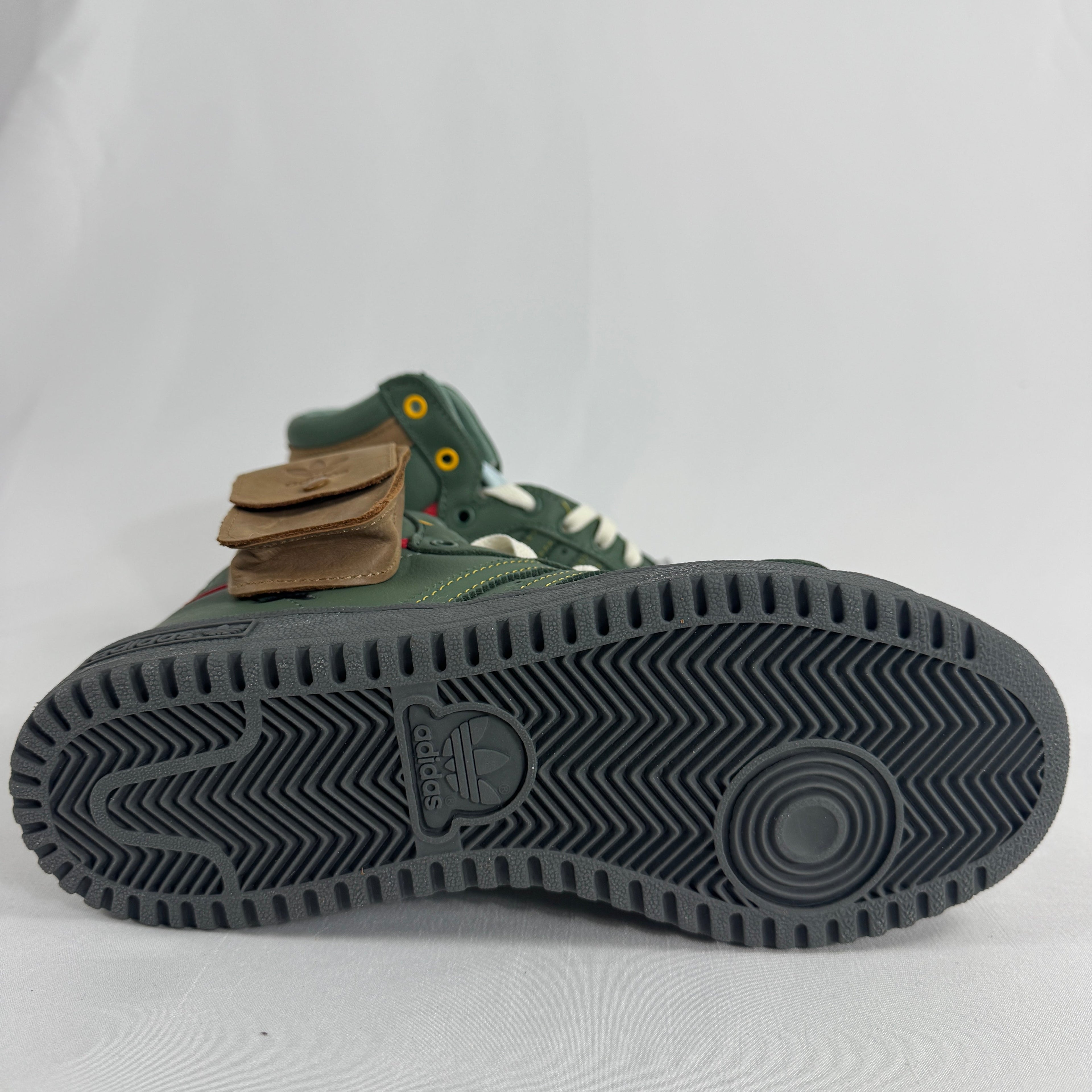 The Adidas Top Ten Hi Star Wars Boba Fett is a high-top basketball-inspired sneaker themed around the Star Wars bounty