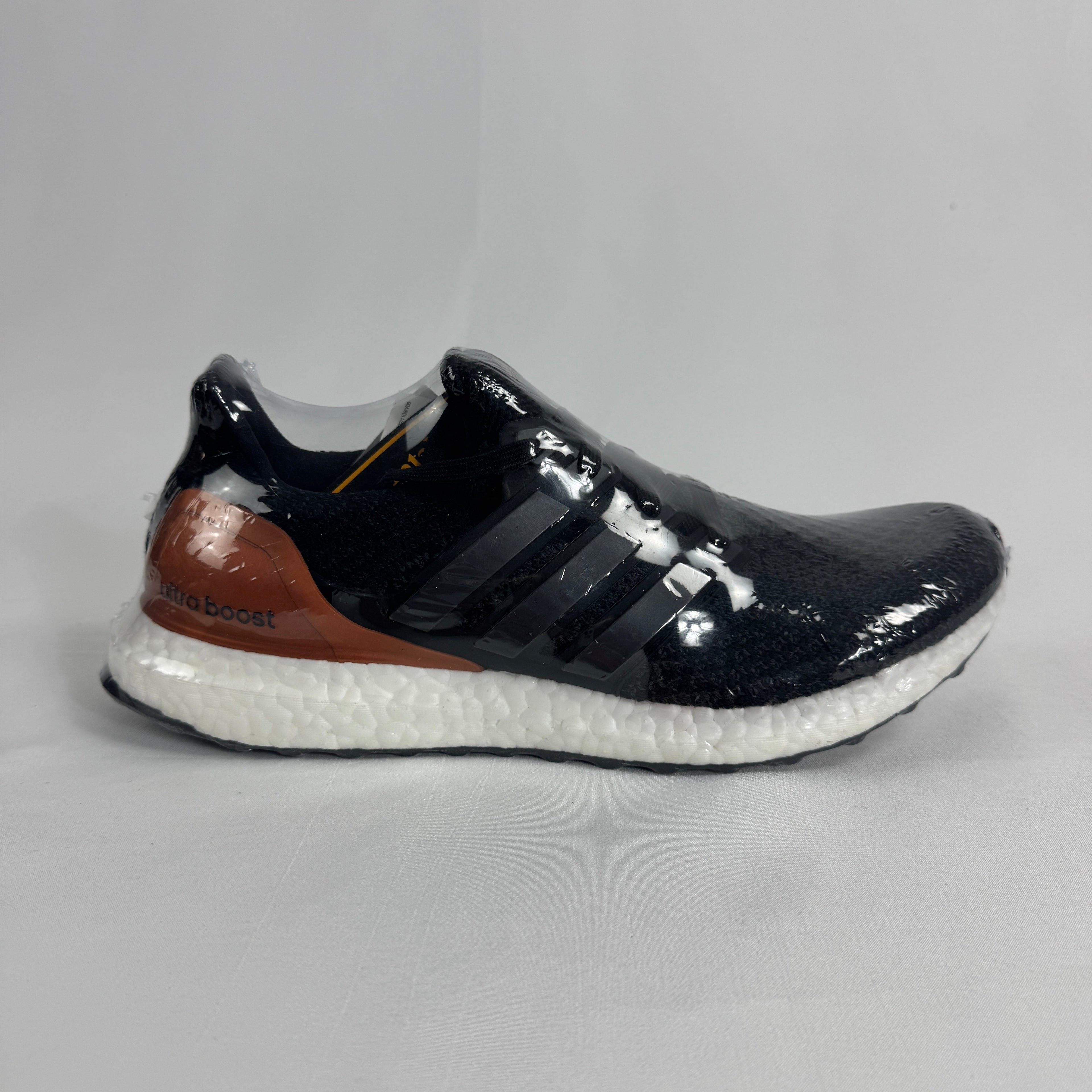 The Adidas Ultra Boost Bronze is a performance-inspired sneaker featuring a breathable Primeknit upper, responsive Boost
