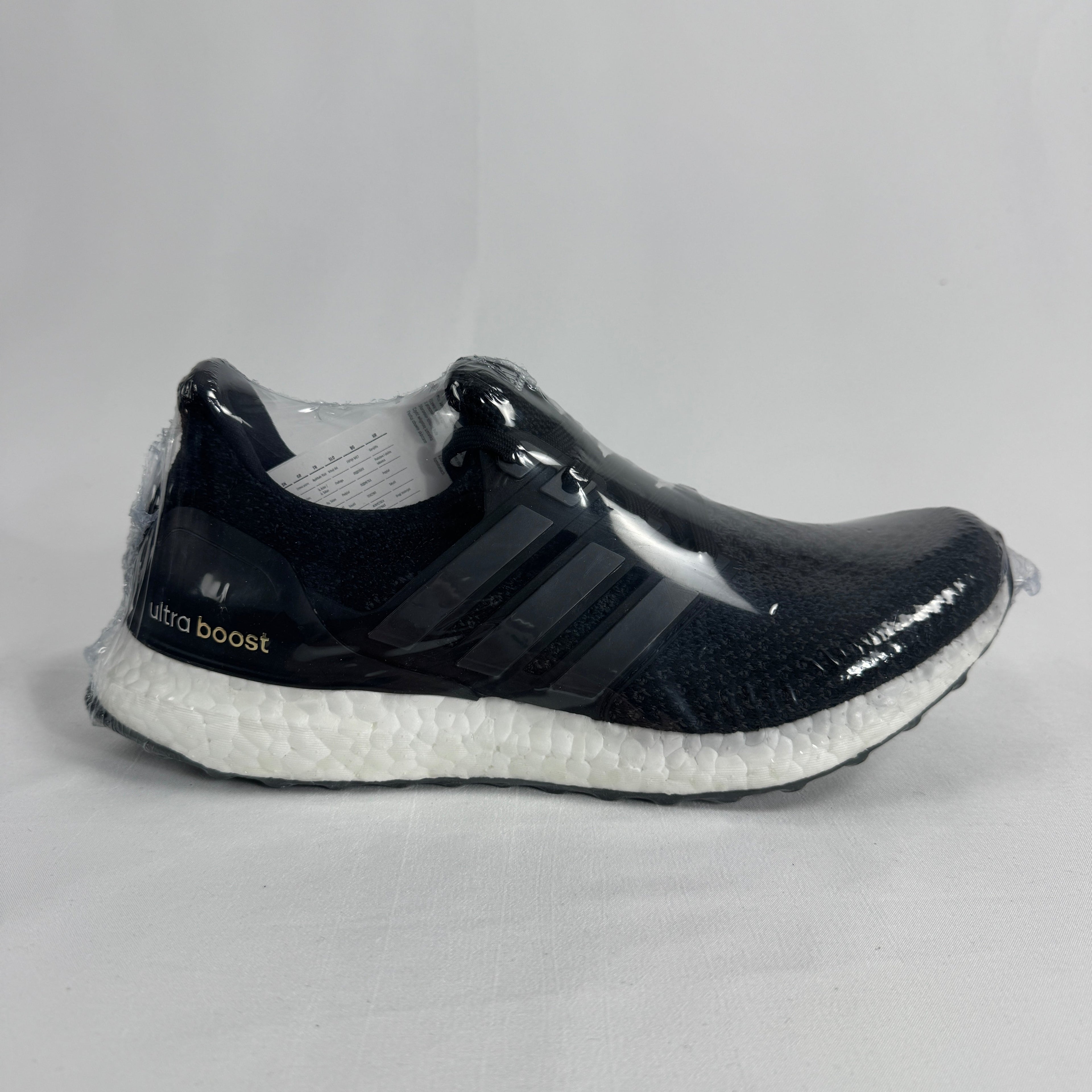 The Adidas Ultraboost 2.0 Core Black White is a running-inspired sneaker featuring a breathable Primeknit upper, responsive