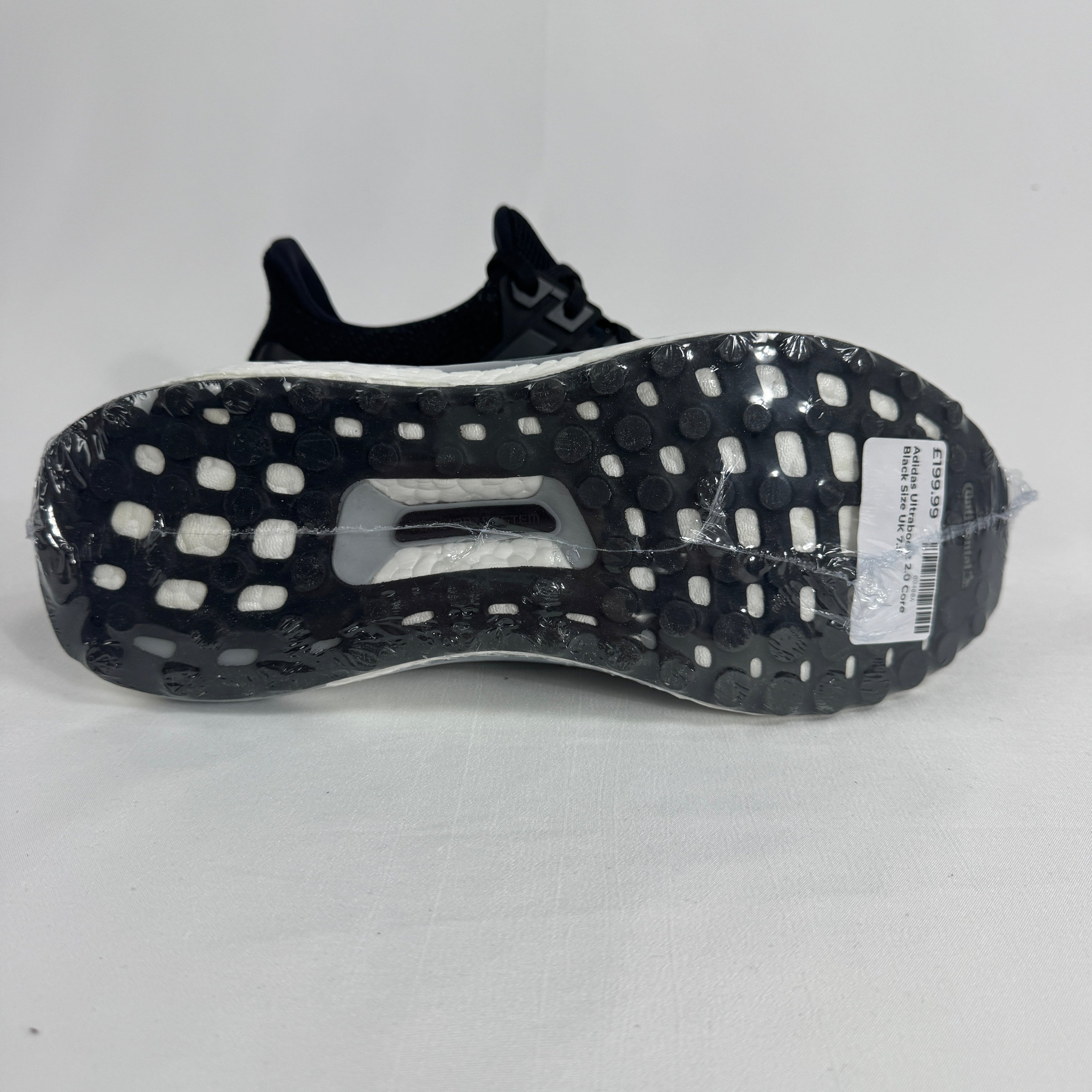 The Adidas Ultraboost 2.0 Core Black White is a running-inspired sneaker featuring a breathable Primeknit upper, responsive