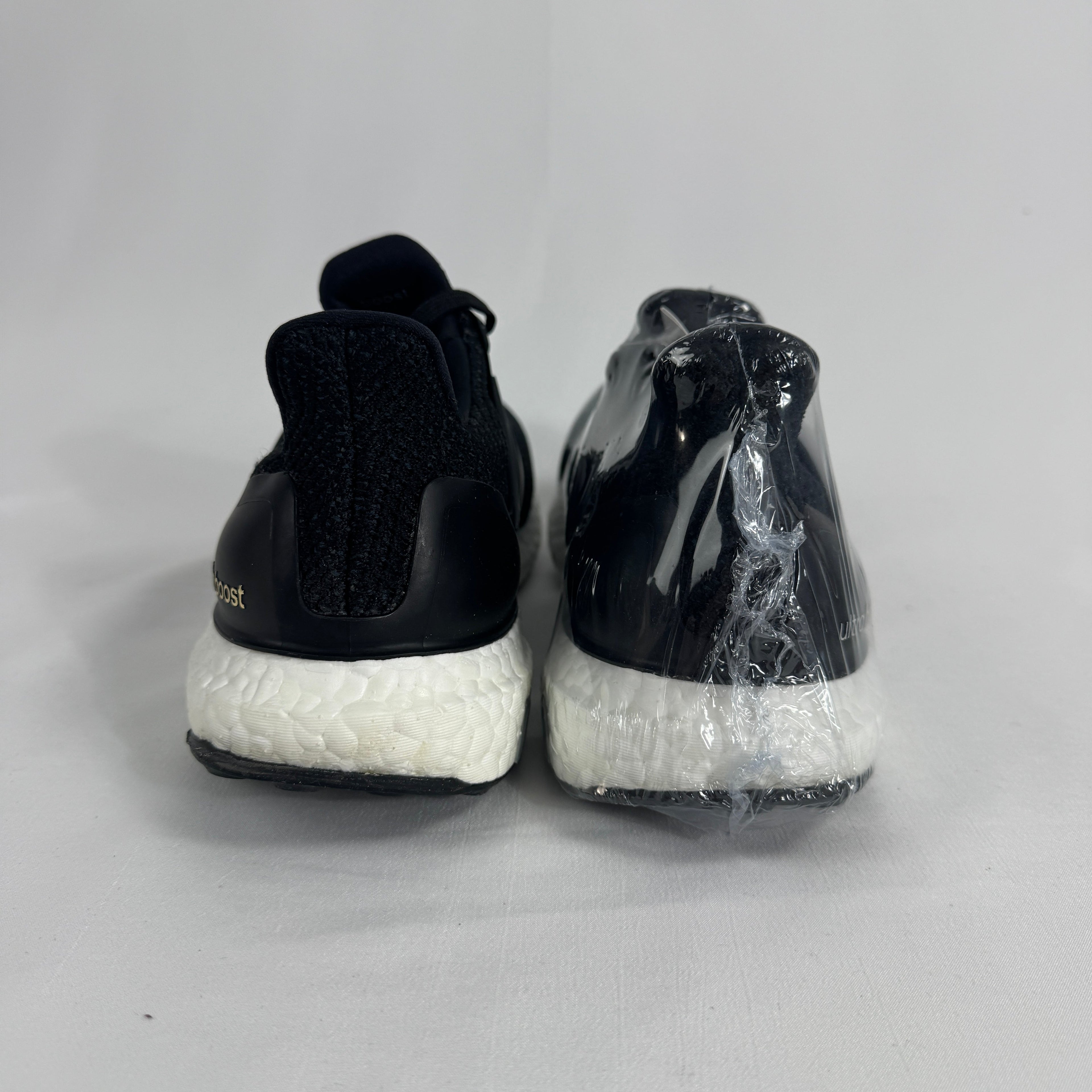 The Adidas Ultraboost 2.0 Core Black White is a running-inspired sneaker featuring a breathable Primeknit upper, responsive
