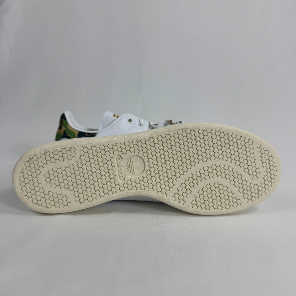 The Adidas x Bape Stan Smith is a collaborative sneaker that blends the classic Stan Smith silhouette with BAPE's signature