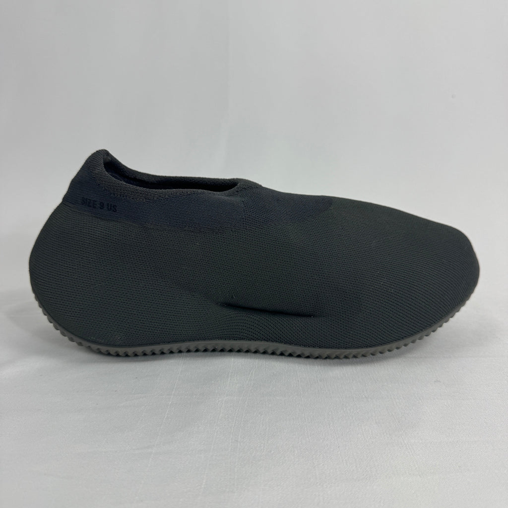The Adidas Yeezy Knit RNR is a slip-on sneaker featuring a fully knitted one-piece upper with a sock-like fit and a sculpted
