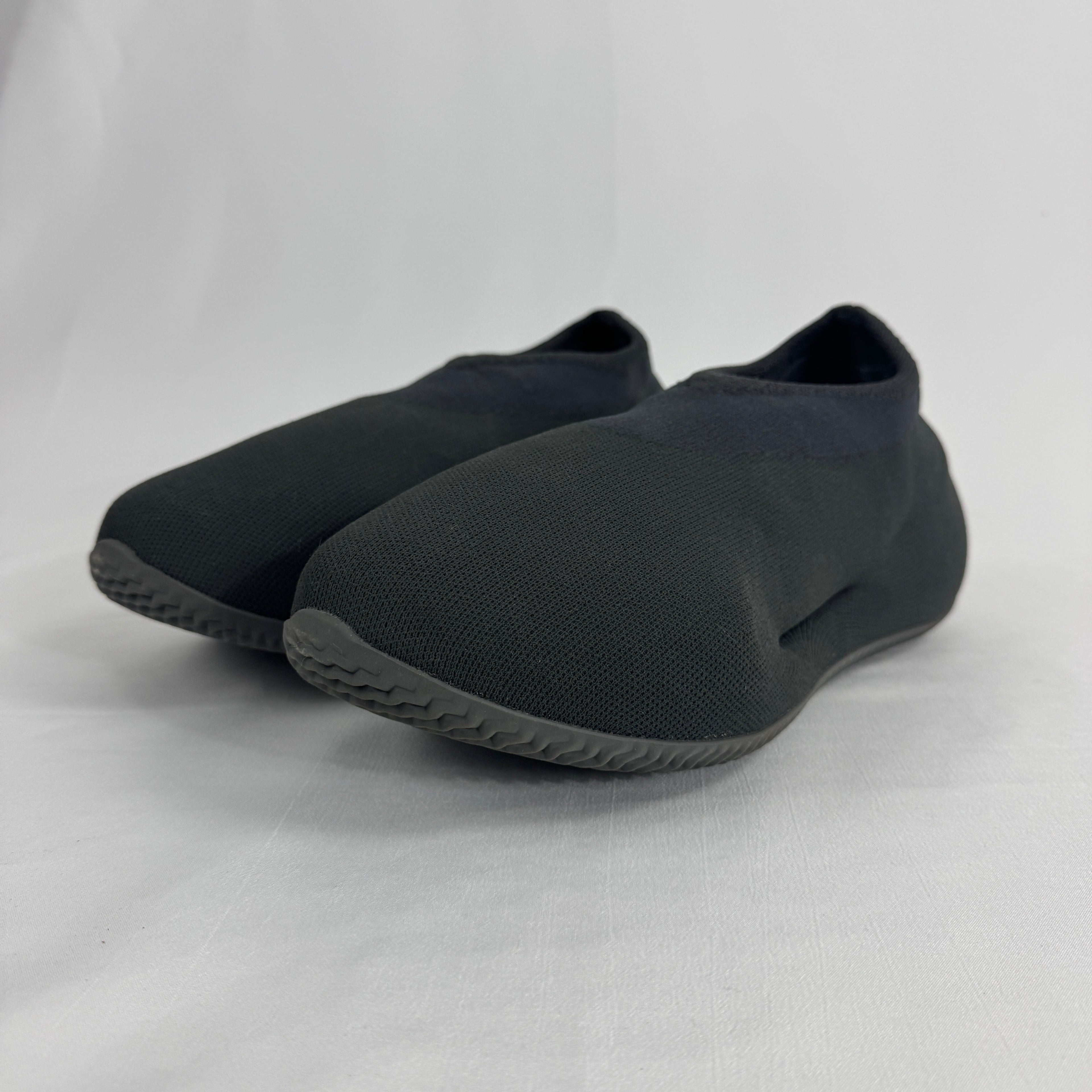 The Adidas Yeezy Knit RNR is a slip-on sneaker featuring a fully knitted one-piece upper with a sock-like fit and a sculpted