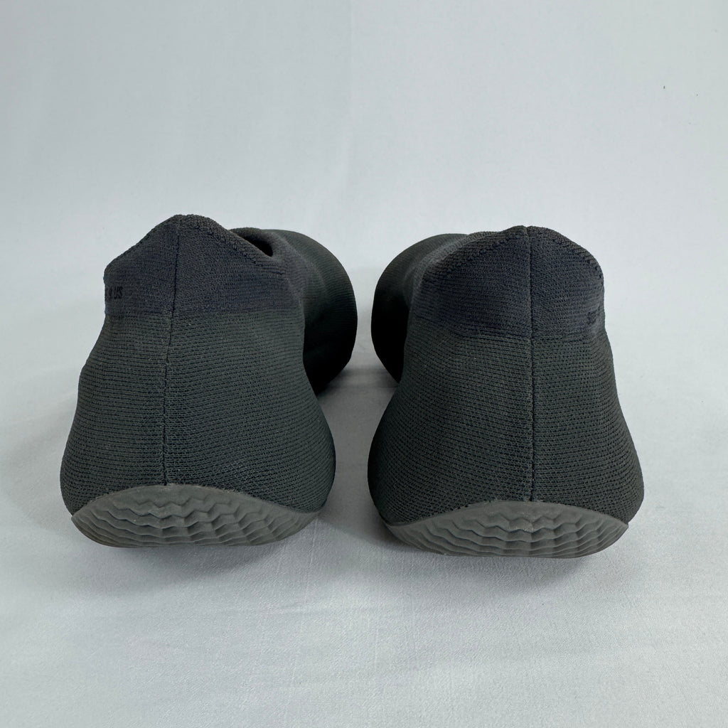 The Adidas Yeezy Knit RNR is a slip-on sneaker featuring a fully knitted one-piece upper with a sock-like fit and a sculpted