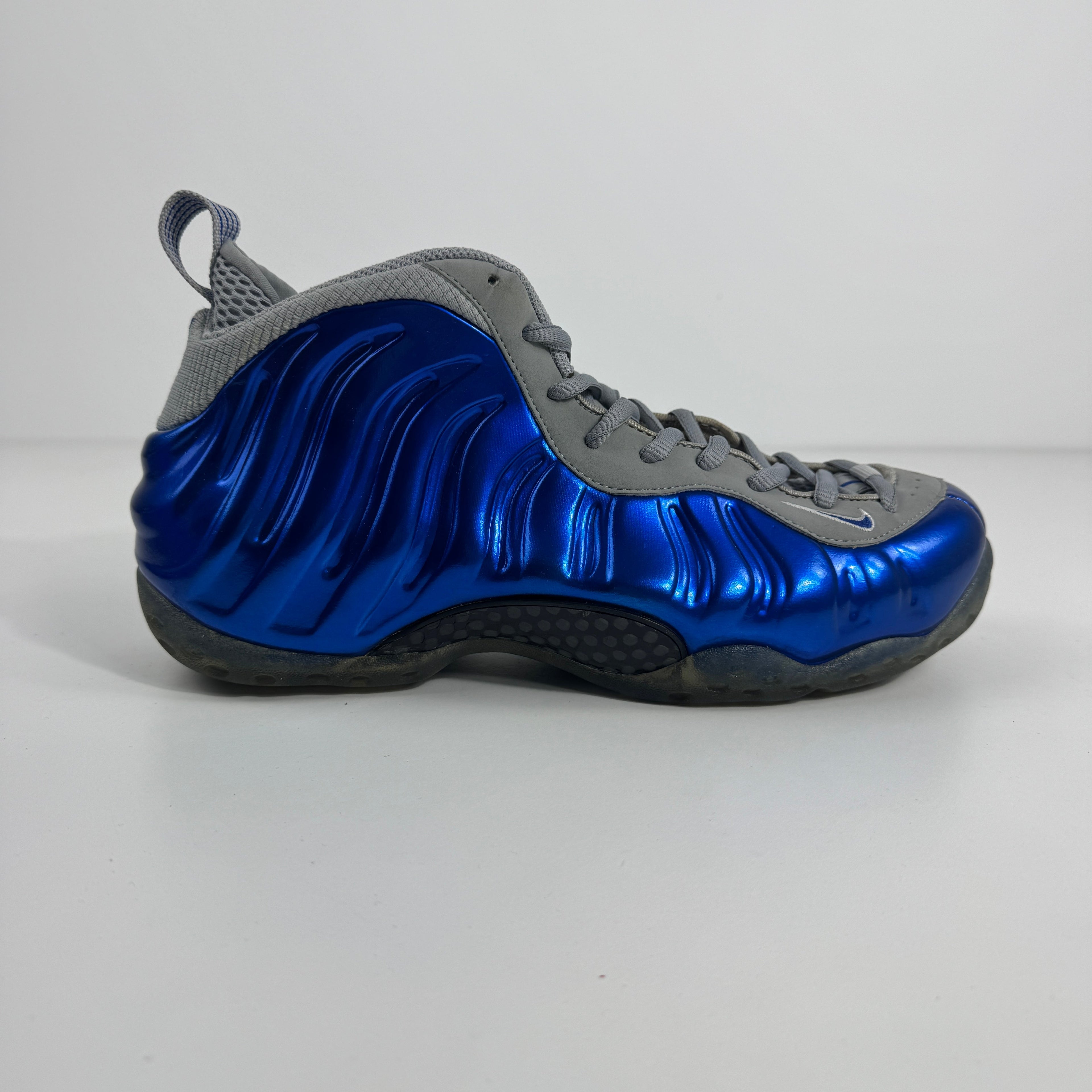 Air Foamposite One is a bold, futuristic sneaker known for its molded Foamposite upper, exceptional durability, and
