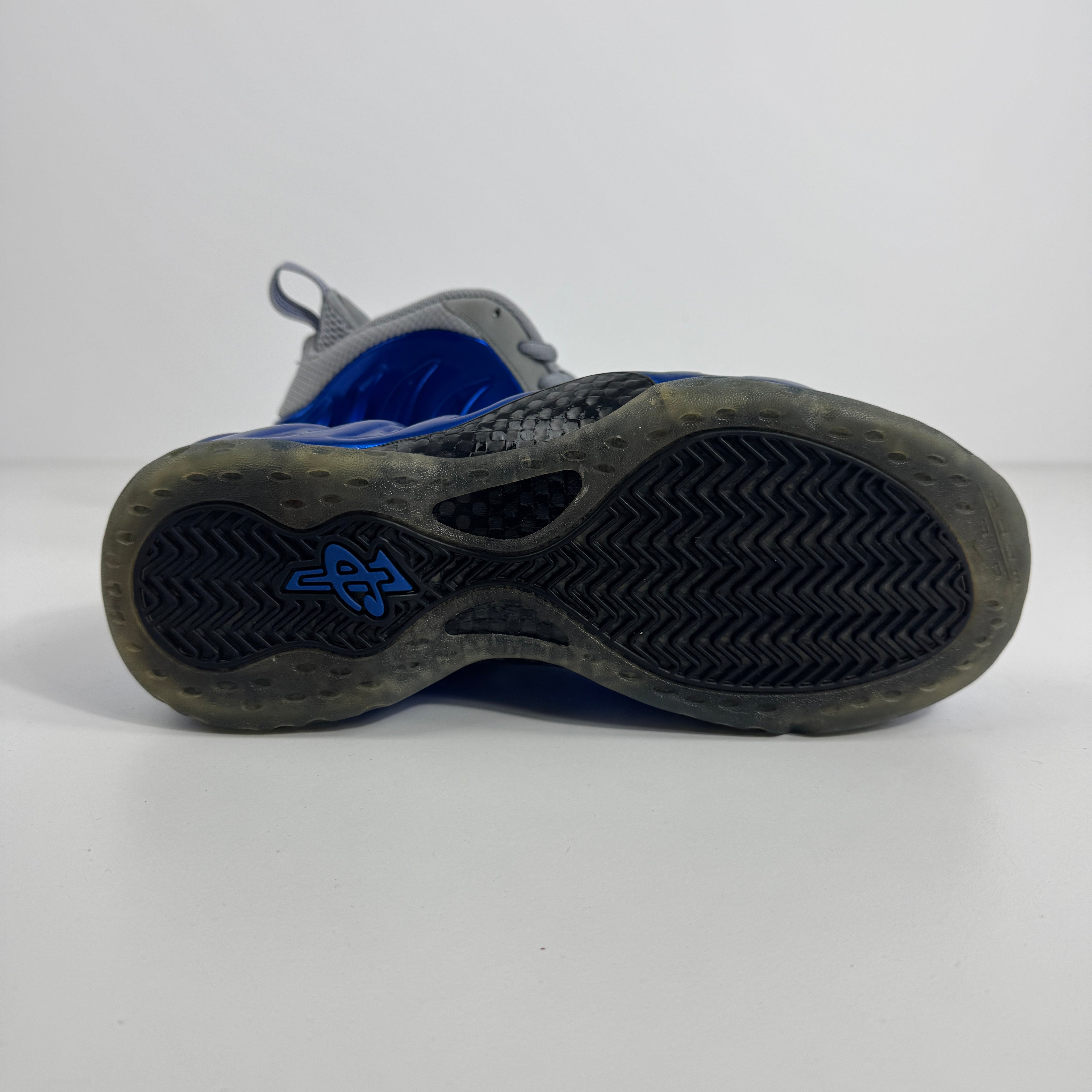 Air Foamposite One is a bold, futuristic sneaker known for its molded Foamposite upper, exceptional durability, and