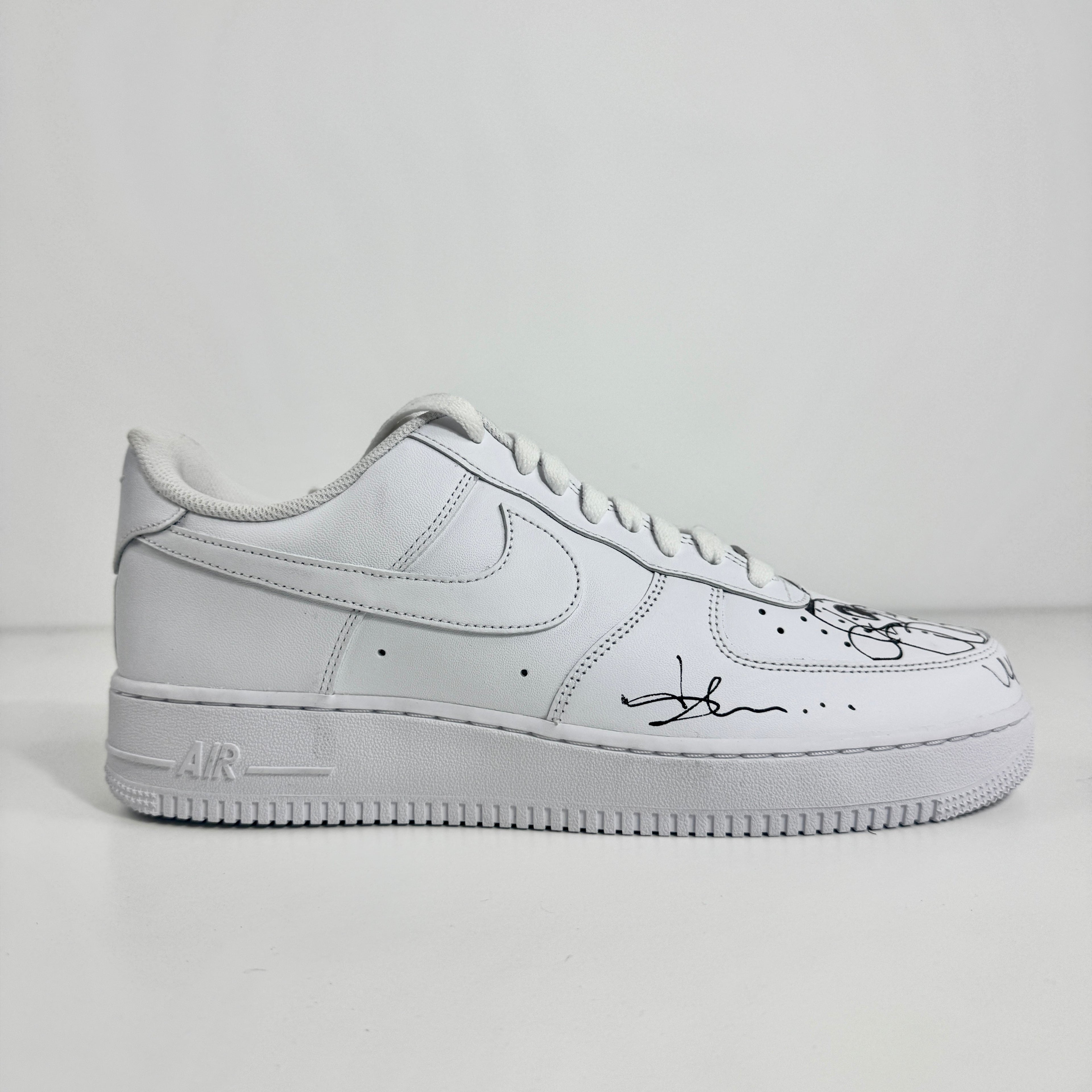 Air Force 1 (Signed by Olaoluslawn) combines the timeless Air Force 1 silhouette with a unique personal touch through