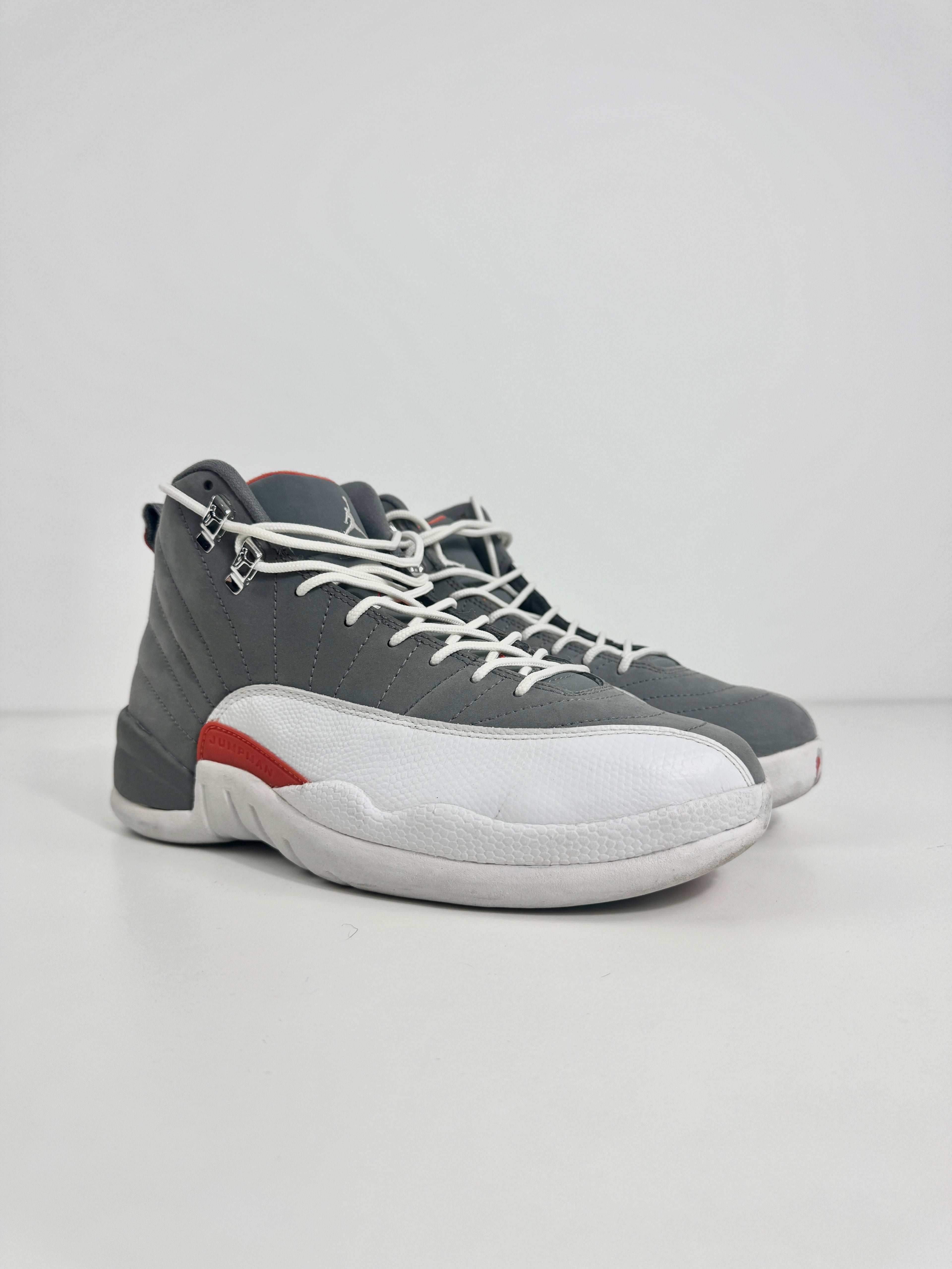 Air Jordan 12 Retro Grey combines a premium grey leather upper with iconic lizard-textured mudguards for a sleek,