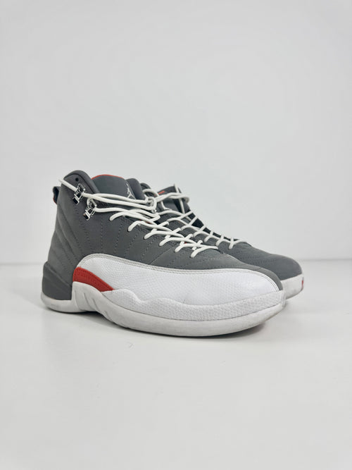 Air Jordan 12 Retro Grey combines a premium grey leather upper with iconic lizard-textured mudguards for a sleek,