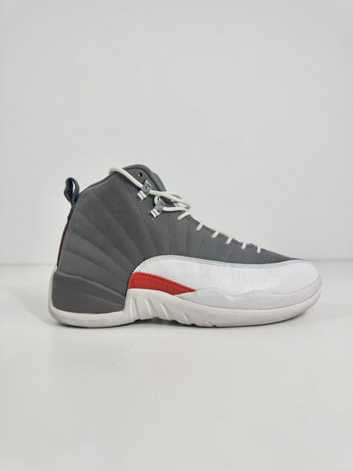 Air Jordan 12 Retro Grey combines a premium grey leather upper with iconic lizard-textured mudguards for a sleek,
