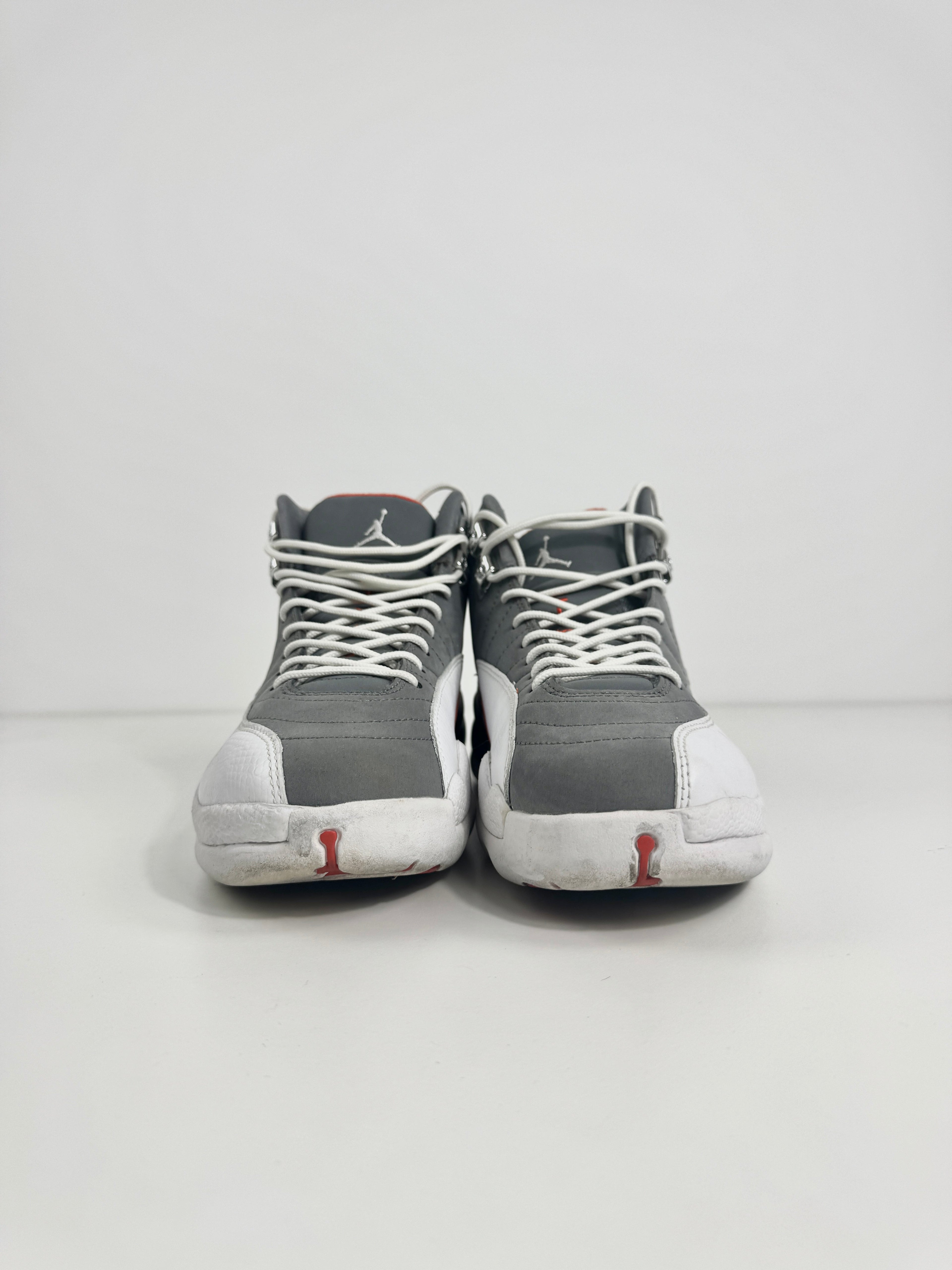Air Jordan 12 Retro Grey combines a premium grey leather upper with iconic lizard-textured mudguards for a sleek,