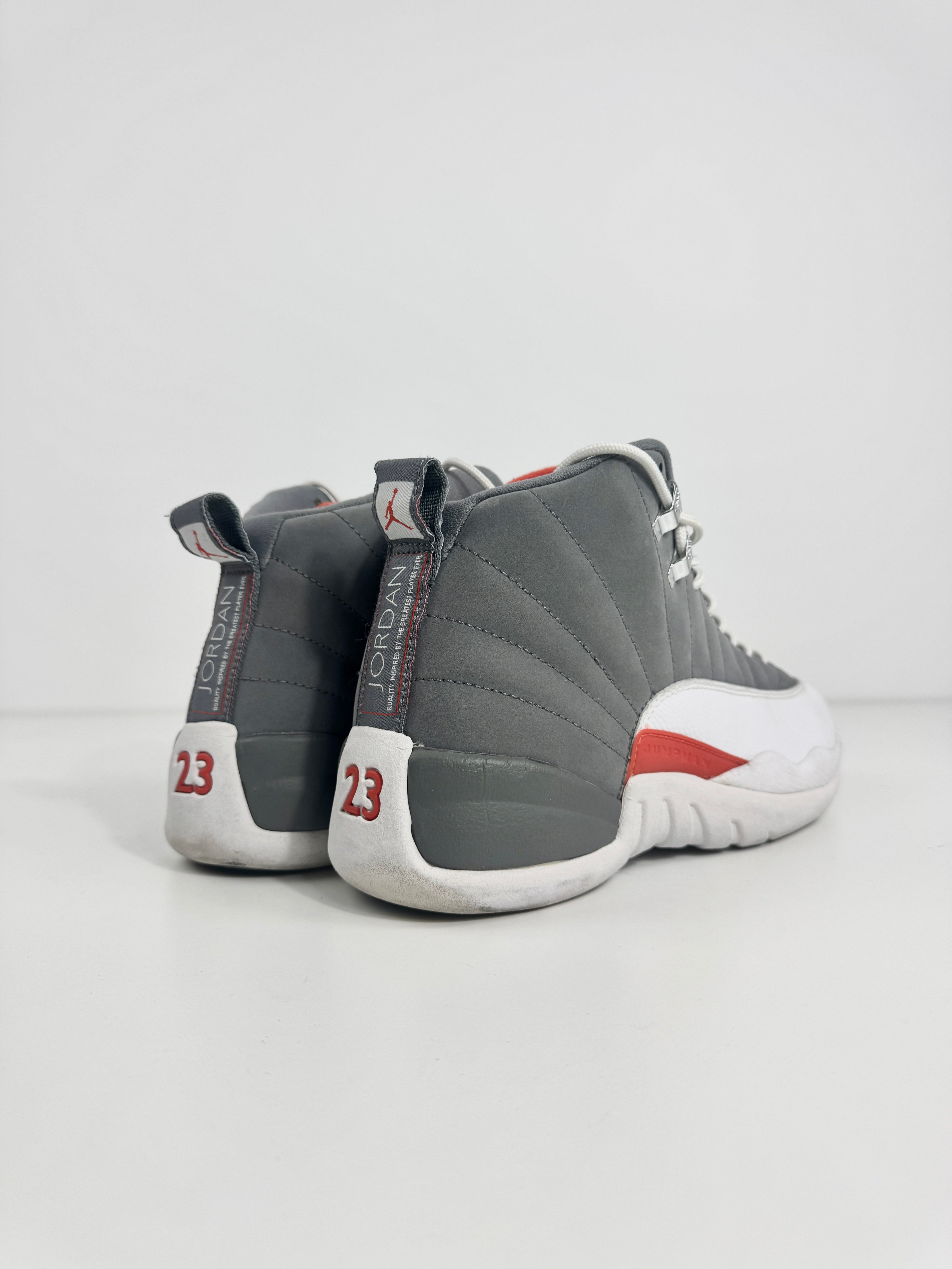 Air Jordan 12 Retro Grey combines a premium grey leather upper with iconic lizard-textured mudguards for a sleek,