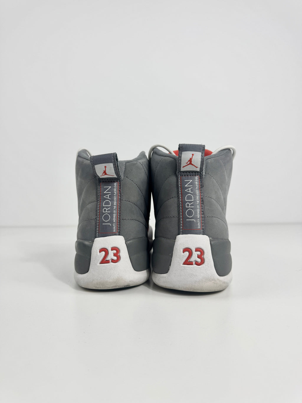 Air Jordan 12 Retro Grey combines a premium grey leather upper with iconic lizard-textured mudguards for a sleek,