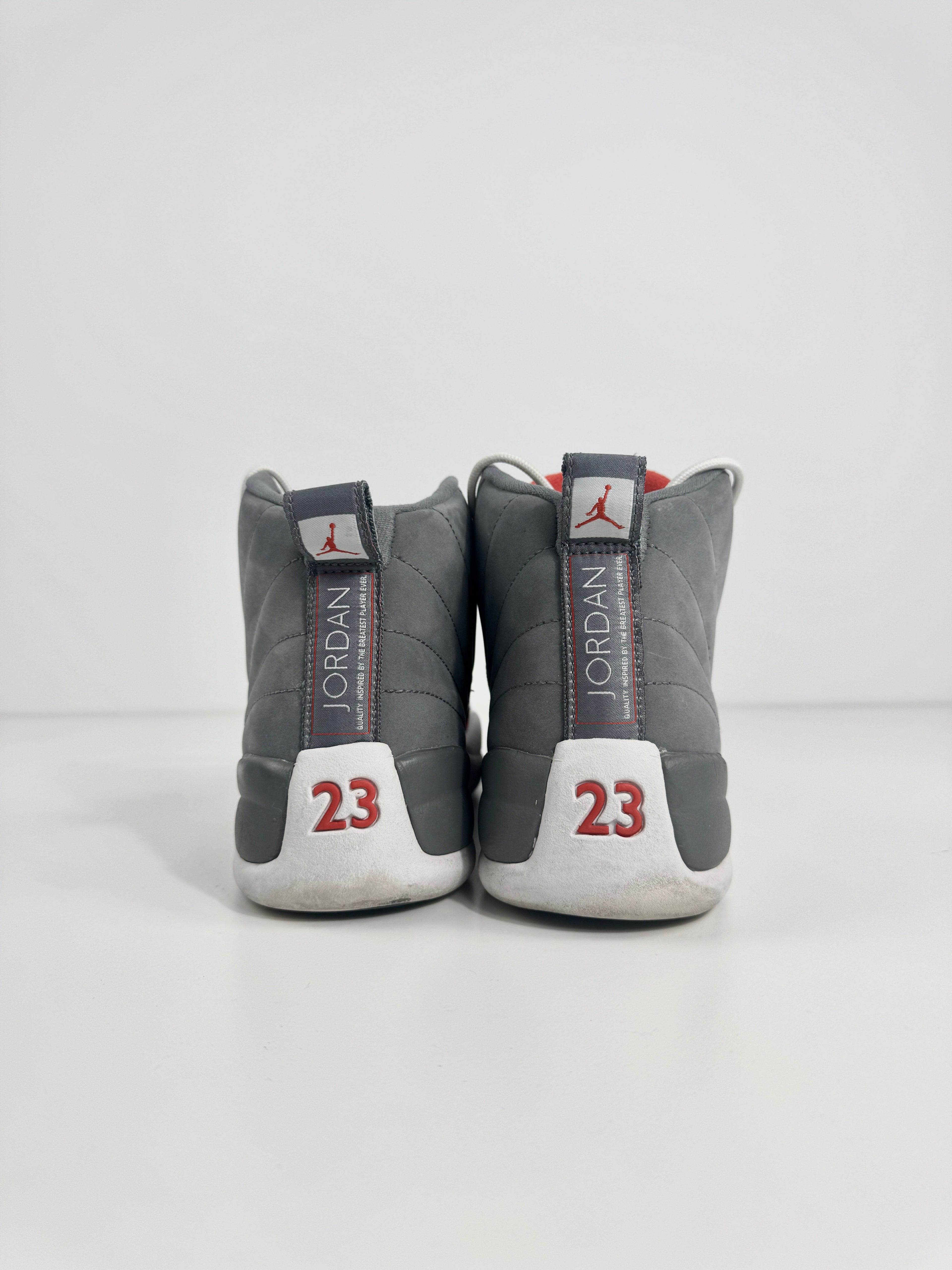 Air Jordan 12 Retro Grey combines a premium grey leather upper with iconic lizard-textured mudguards for a sleek,