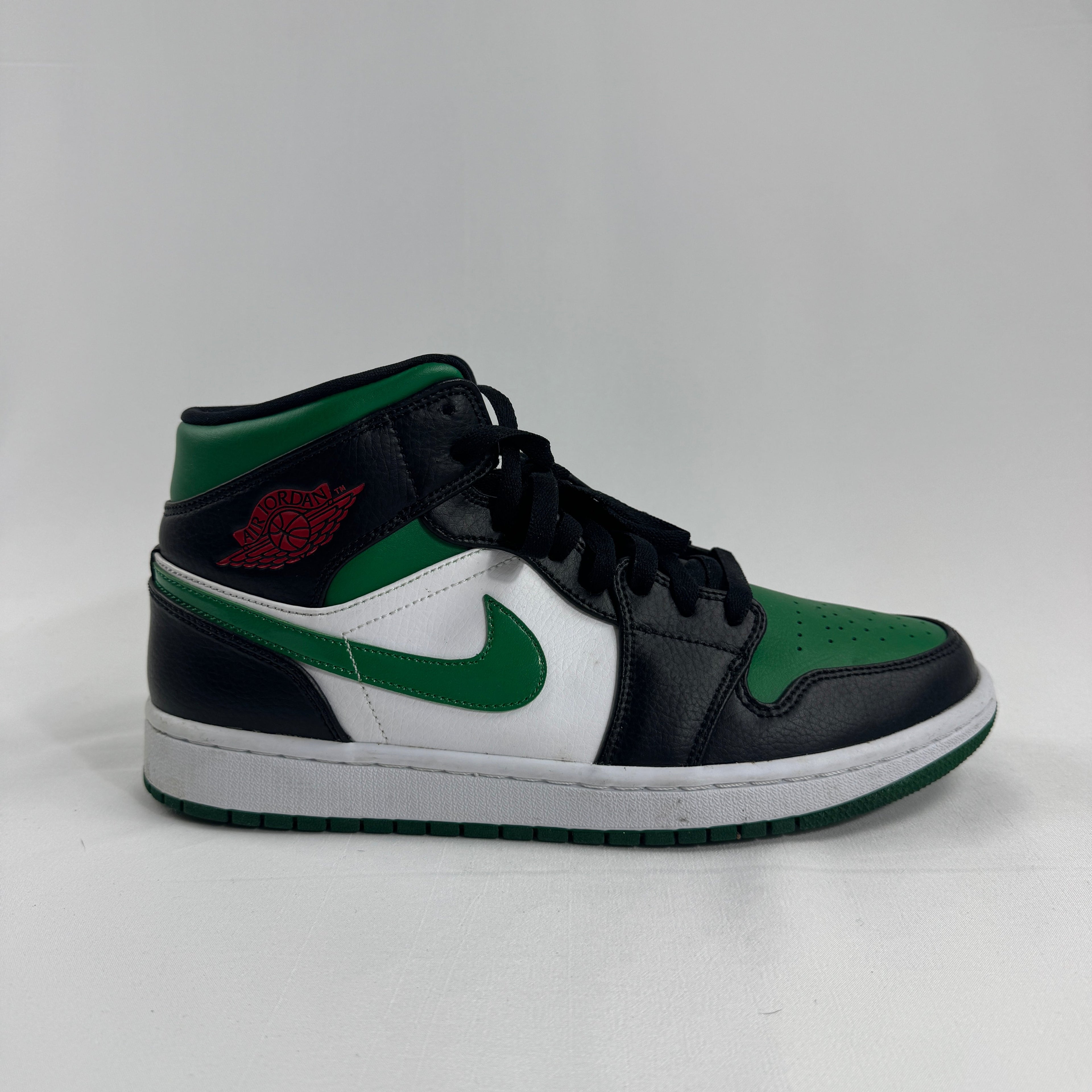 Air Jordan 1 Mid Black/Pine Green is a versatile take on the classic Air Jordan 1 Mid silhouette, featuring a sleek black