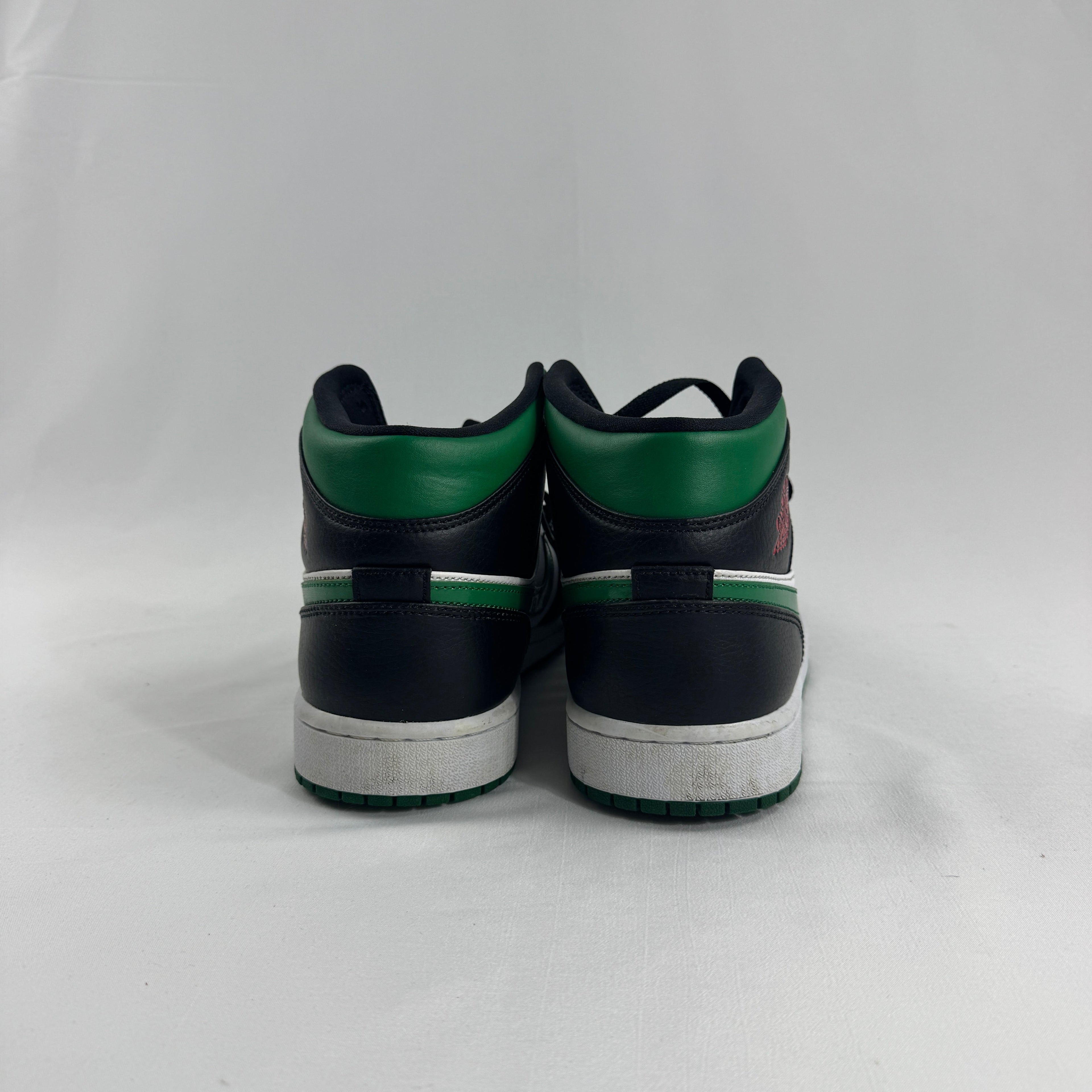 Air Jordan 1 Mid Black/Pine Green is a versatile take on the classic Air Jordan 1 Mid silhouette, featuring a sleek black