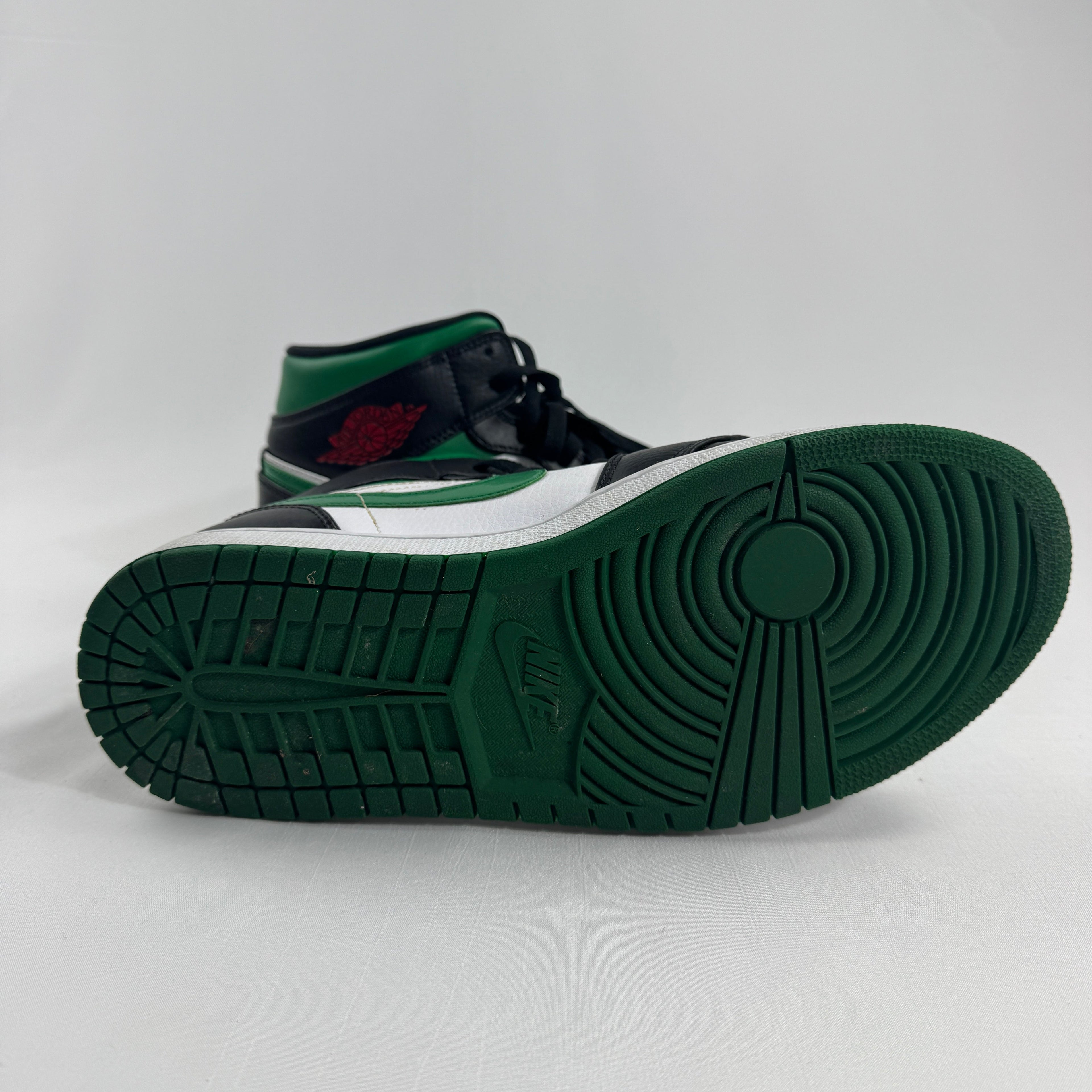 Air Jordan 1 Mid Black/Pine Green is a versatile take on the classic Air Jordan 1 Mid silhouette, featuring a sleek black