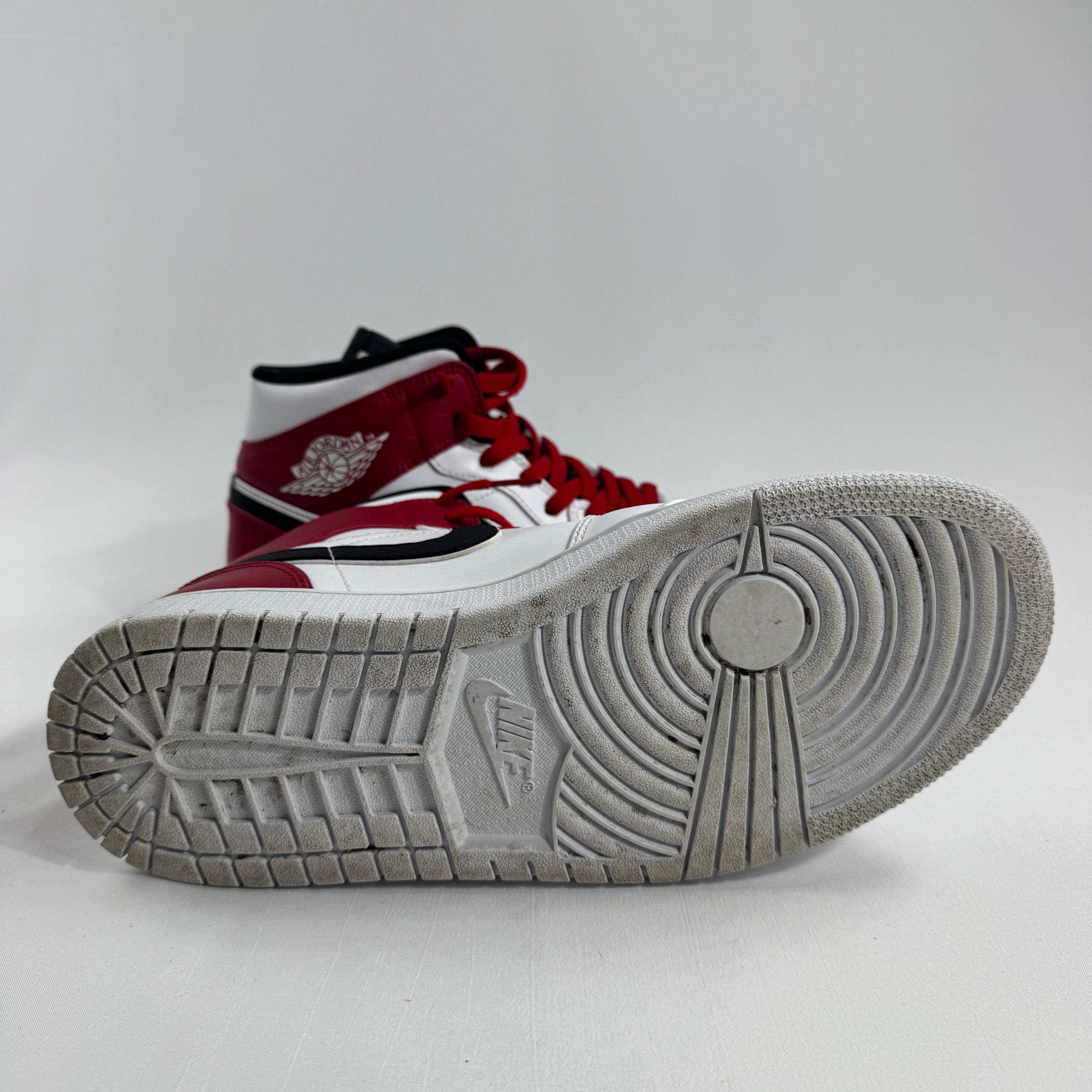 Air Jordan 1 Mid Red/White/Black combines one of the most iconic color palettes in sneaker history with the versatile Air