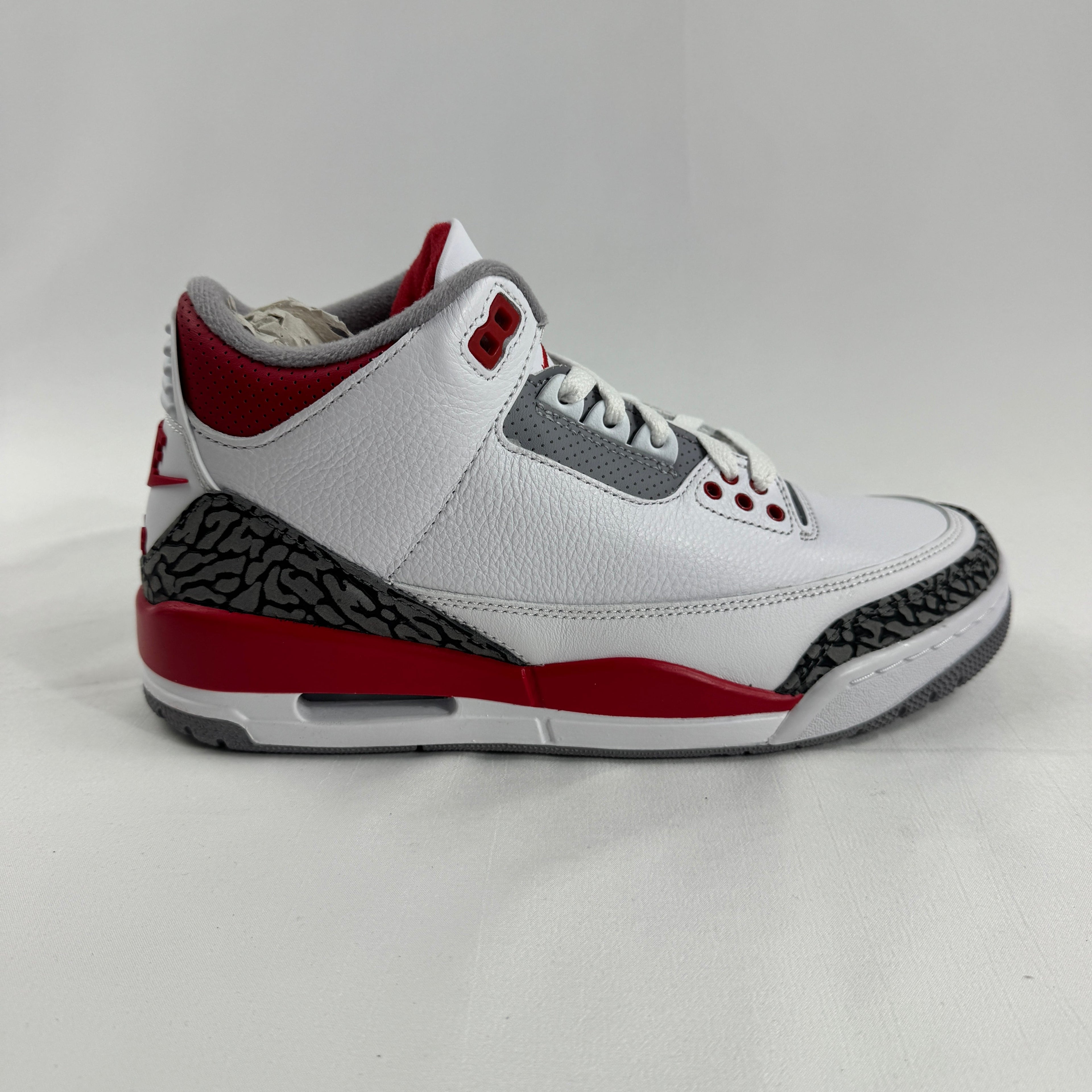The Air Jordan 3 Retro Cement Grey combines the iconic Air Jordan 3 silhouette with a clean white leather upper, cement grey