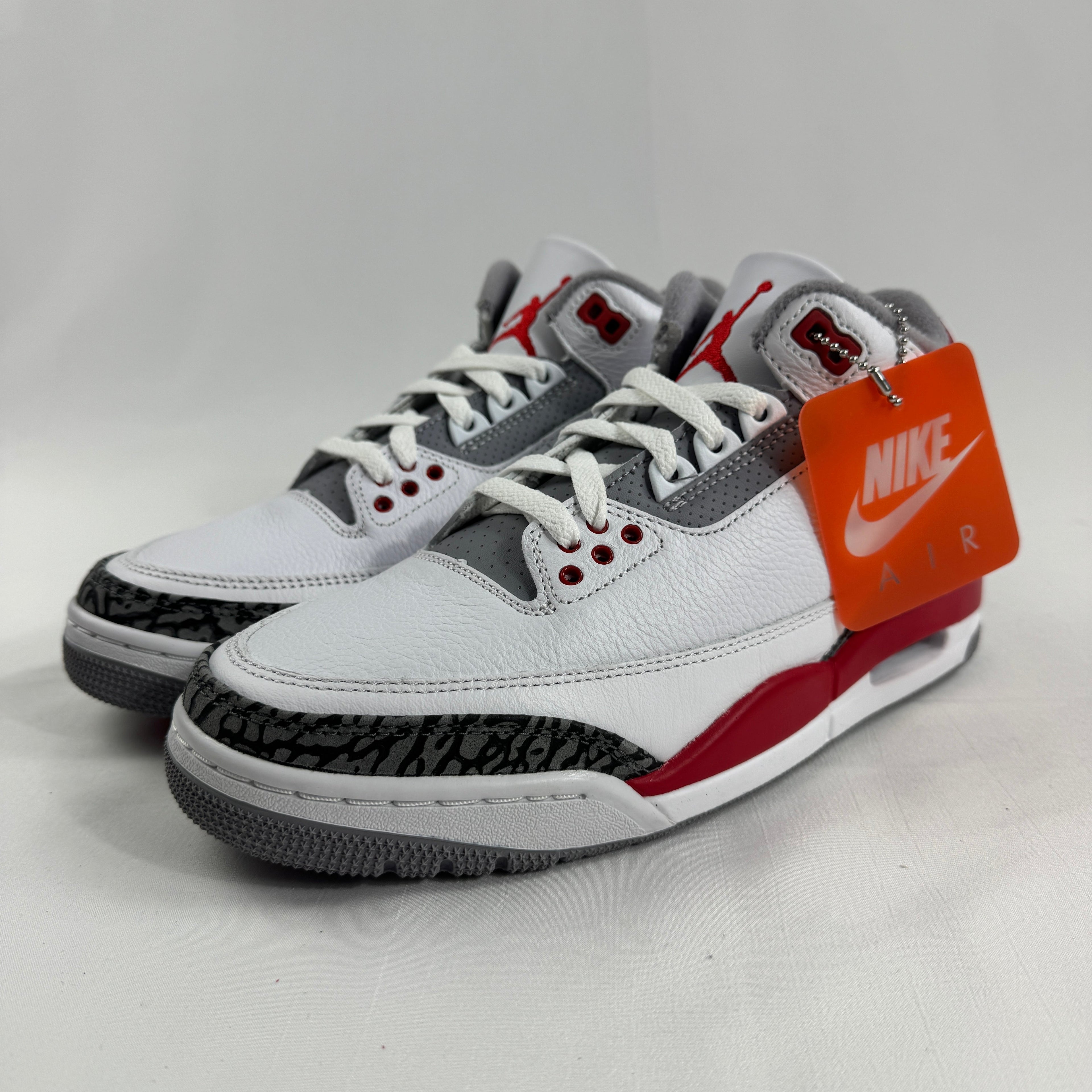 The Air Jordan 3 Retro Cement Grey combines the iconic Air Jordan 3 silhouette with a clean white leather upper, cement grey