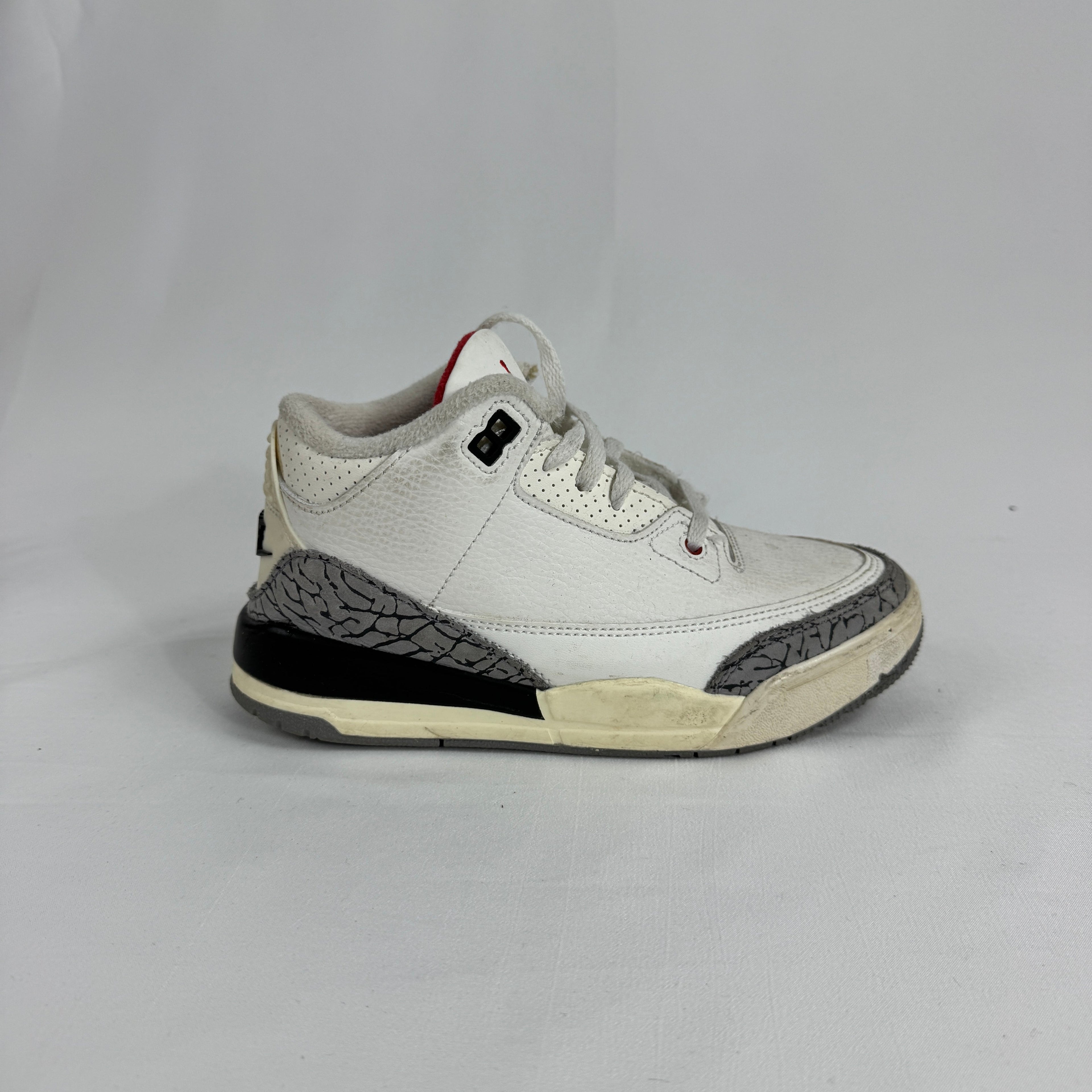 The Air Jordan 3 Toddler White Cement brings one of Jordan Brand’s most iconic designs to little feet. Featuring a clean
